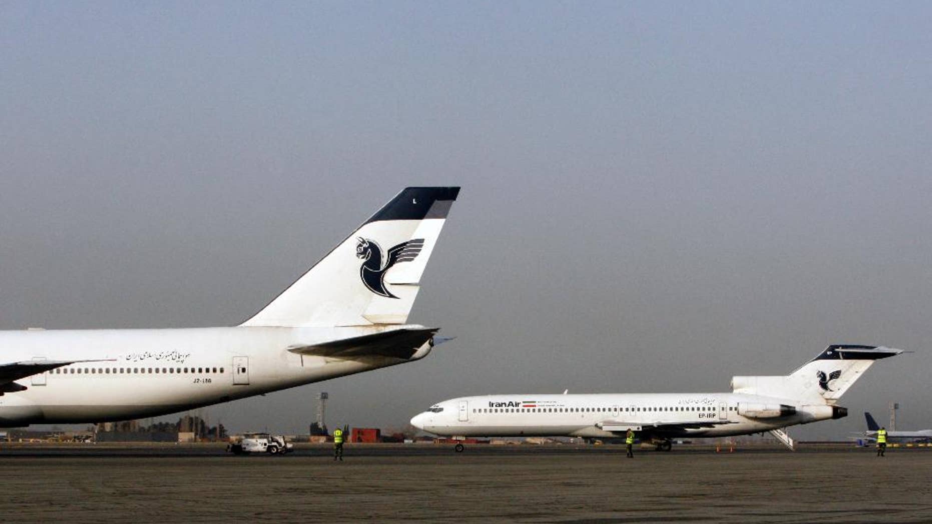 FILE -- In this March 2, 2008 file photo, two passenger planes of Iran's national air carrier, Iran Air, are parked at the Mehrabad Airport in Tehran, Iran. Airbus announced Wednesday, Sept. 21, 2016, that the U.S. government has granted it a license allowing it to sell the first 17 planes involved in a landmark deal with Iran. Most Iranian planes were purchased before the 1979 Islamic Revolution that ousted Shah Mohammad Reza Pahlavi and brought Islamists to power. (AP Photo/Vahid Salemi, File)