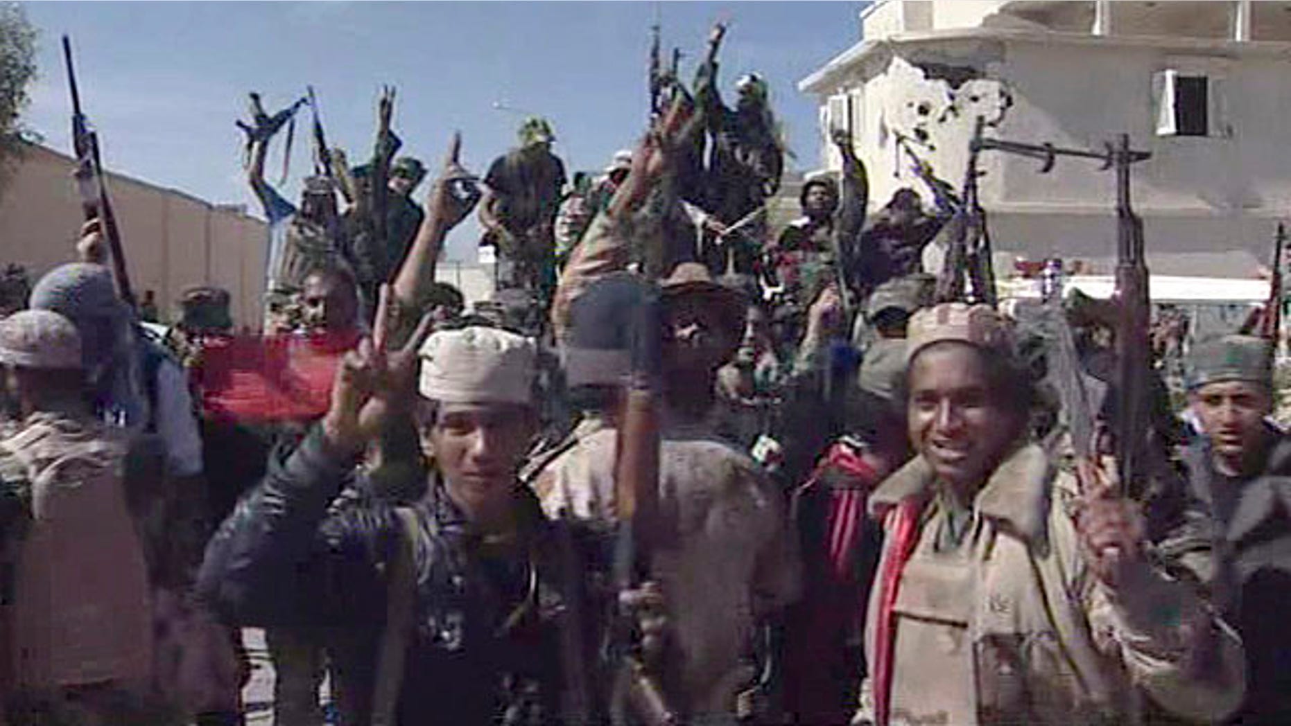 Oct. 20, 2011: Libyan fighters celebrate in the streets of Sirte, Libya, in this image taken from TV. The Libyan fighters on Thursday overran the remaining positions of Muammar Qaddafi loyalists in his hometown of Sirte, ending the last major resistance by former regime supporters still holding out two months after the fall of the capital Tripoli.