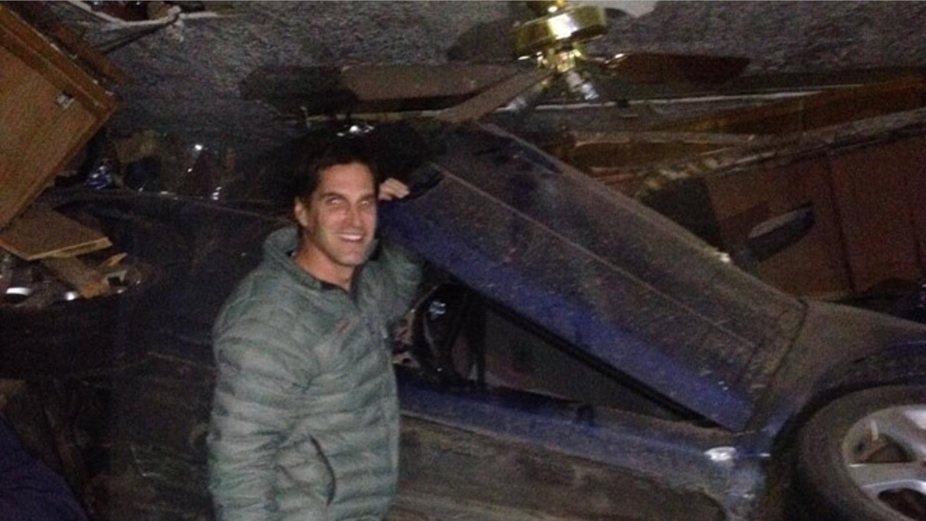 Nov. 28, 2013: Josh Romney, son of former presidential candidate Mitt Romney, tweeted this photo of himself at an accident scene in which he helped a family of four after they crashed into a house in Holladay, Utah. No one was hurt in the accident.