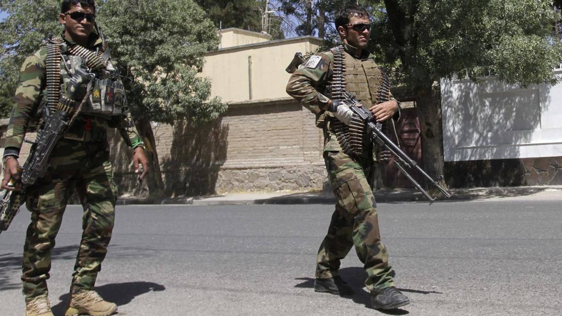Afghanistan's National Army soldiers patrol in Herat, west of Kabul, Afghanistan, Wednesday, Aug. 12, 2015. The Taliban issued a statement about the fighting giving a much higher figure for police casualties. The insurgents regularly exaggerate their gains. (AP Photo/Hoshan Hashimi)