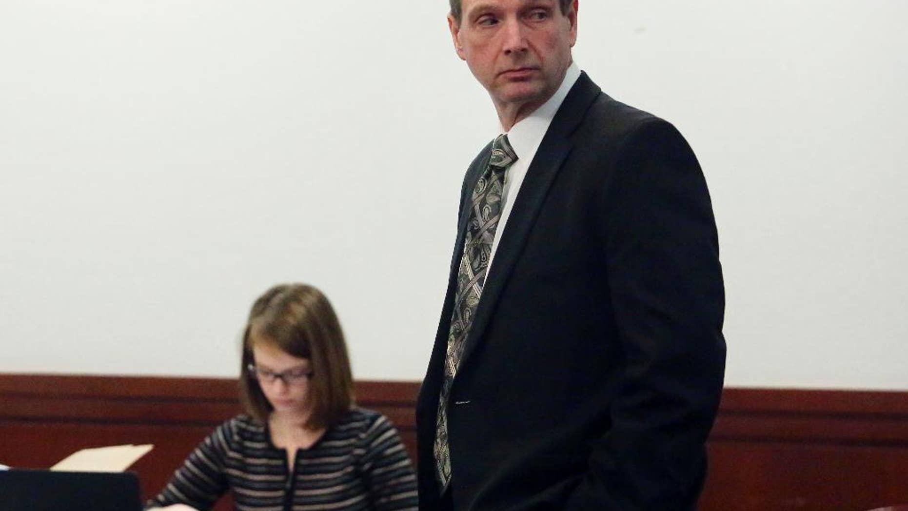 In this March 8, 2017 photo, Curtis Lovelace waits for proceedings in his trial to begin at the Sangamon County Courthouse in Springfield, Ill. Lovelace, a former Adams County assistant state's attorney, is accused in the 2006 death of his first wife, Cory Lovelace. His first trial ended with a deadlocked jury. (Michael Kipley/Quincy Herald-Whig via AP, Pool)