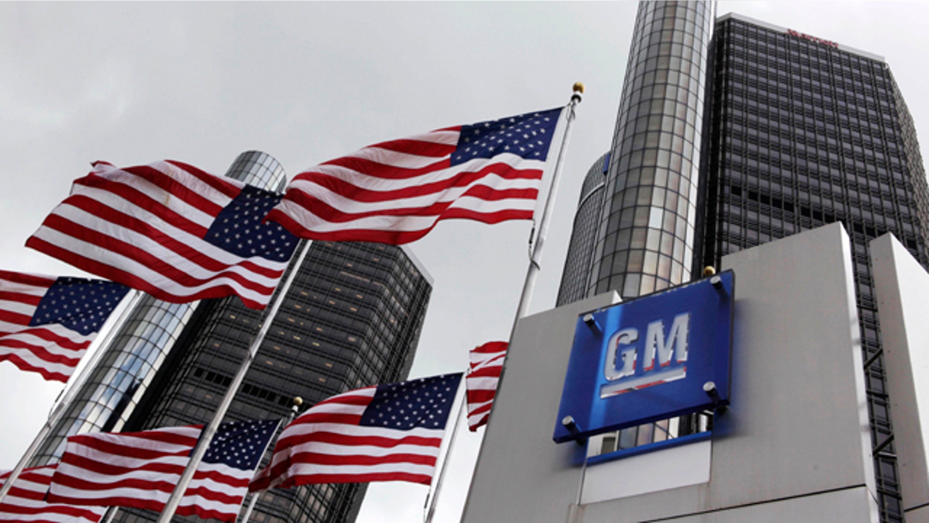 FILE: American flags fly outside General Motors world headquarters in Detroit.