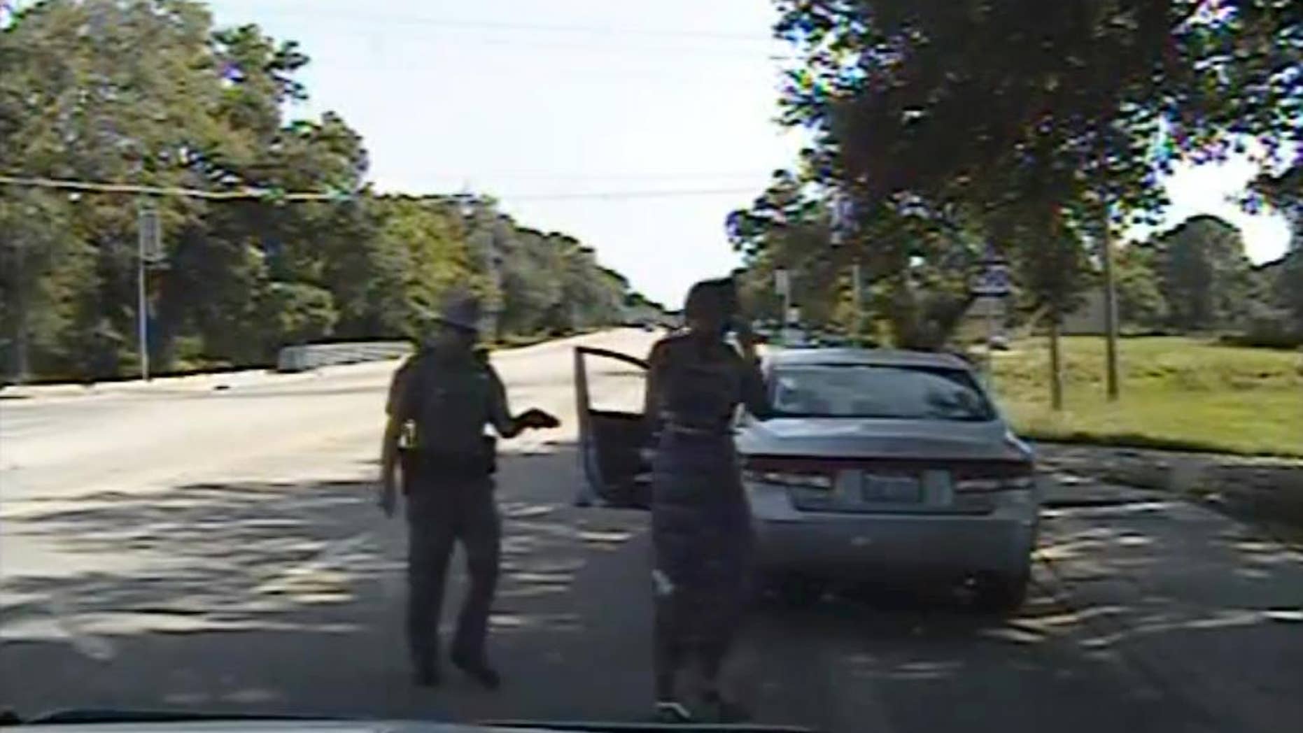 FILE - In this July 10, 2015, file frame from dashcam video provided by the Texas Department of Public Safety, trooper Brian Encinia arrests Sandra Bland after she became combative during a routine traffic stop in Waller County, Texas. Bland's family filed a wrongful-death lawsuit Tuesday, Aug. 4, 2015, against Encinia and other officials, saying it was a last resort after being unable to get enough information about the case. (Texas Department of Public Safety via AP, File)