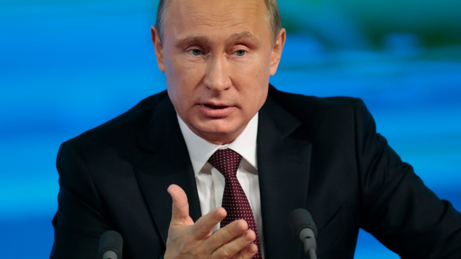 Russian President Vladimir Putin speaks at his annual news conference in Moscow, Russia, Thursday, Dec. 19, 2013. (AP Photo/Ivan Sekretarev)