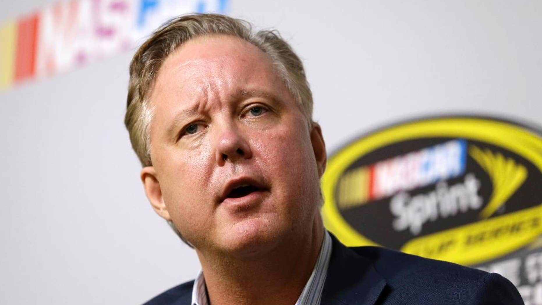 FILE - In this Nov. 20, 2015, file photo, Brian France, NASCAR Chairman and CEO, talks to reporters at a news conference during NASCAR Championship auto racing weekend at Homestead-Miami Speedway in Homestead, Fla. At a time when other sports are leading the charge toward a brighter social future, the good ol' boys seem intent on returning us to a more divisive era. (AP Photo/Alan Diaz, File)