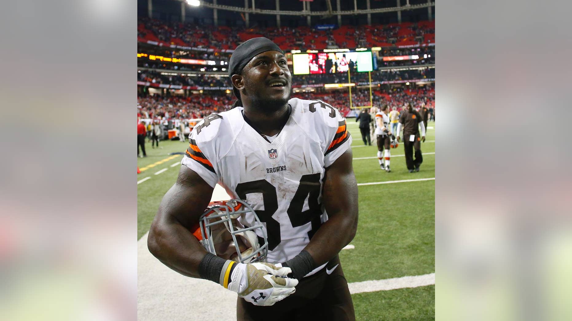 Cleveland Browns running back Isaiah Crowell (34) walks off the field after the Cleveland Browns beat the Atlanta Falcons 26-24 in the second half of an NFL football game, Sunday, Nov. 23, 2014, in Atlanta. (AP Photo/John Bazemore)