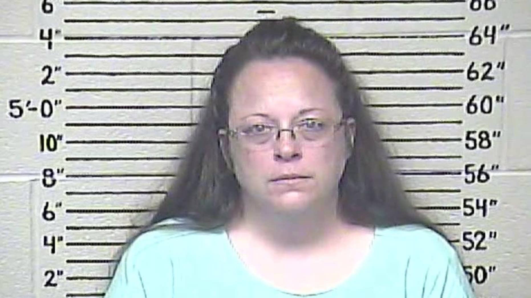 This Thursday, Aug. 3, 2015 photo made available by the Carter County Detention Center shows Kim Davis. The Rowan County, Ky. clerk went to jail Thursday for refusing to issue marriage licenses to gay couples, but five of her deputies agreed to comply with the law, ending a two-month standoff.