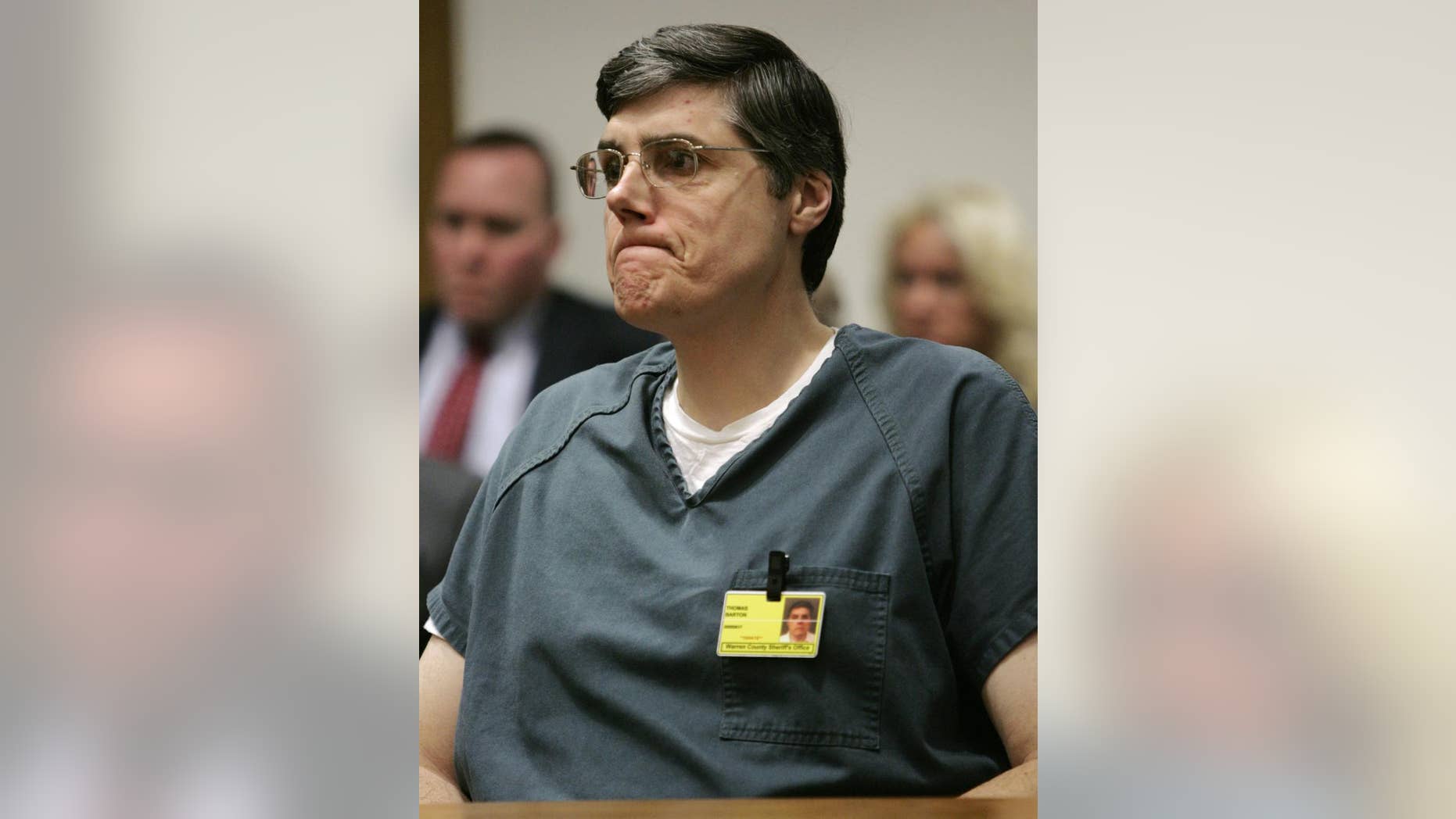FILE - This Friday March 18, 2005 file photo shows former Springboro Police Lt. Thomas "Jim" Barton listening as he is given the maximum sentence in the shooting death of his wife in Warren County Court in Lebanon, Ohio. The attorney for Barton, a former police official wants a judge to set bail for him in southwest Ohio after a federal court threw out his 2005 conviction on charges from his wife's slaying in a botched burglary. (AP Photo/Al Behrman, File)