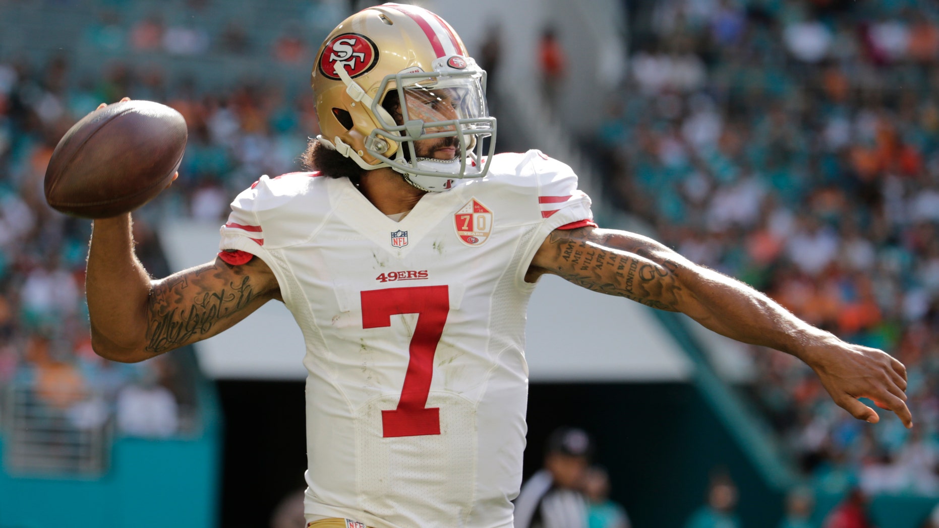 San Francisco 49ers quarterback Colin Kaepernick looks to pass during a game against the Miami Dolphins.
