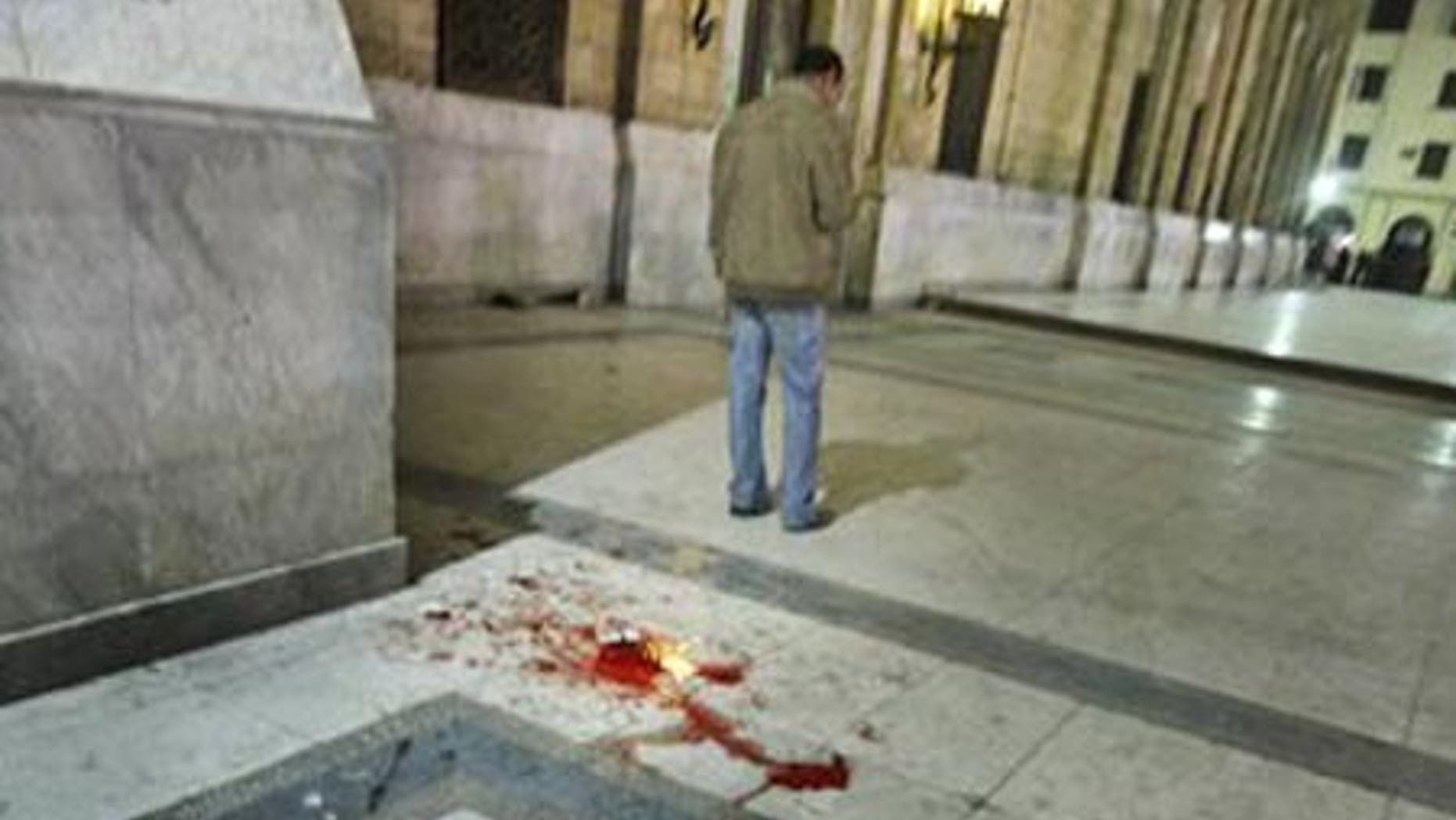Feb. 22: Blood is seen on the ground following a bomb blast outside the Al-Husseini mosque.