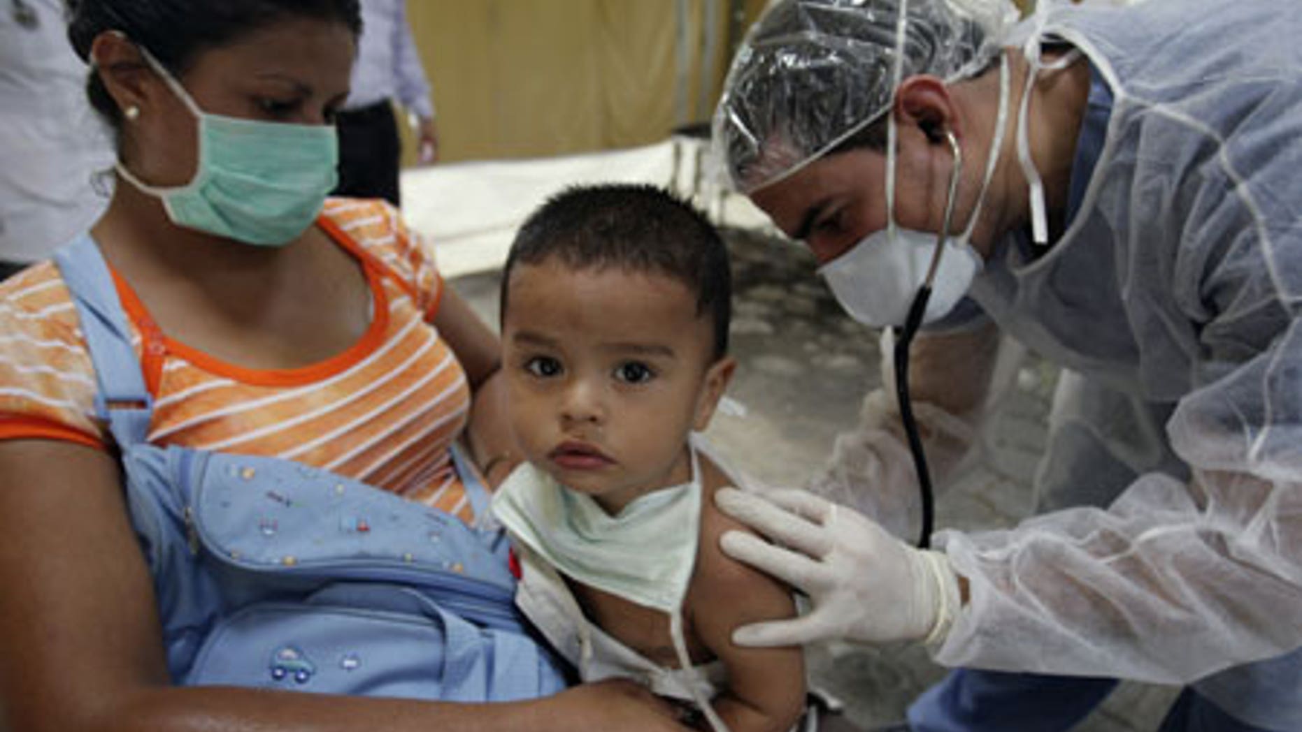 June 2, 2009: A doctor checks on a child suspected of having H1N1 at a mobile clinic in the Children's Hospital in Nicaragua.