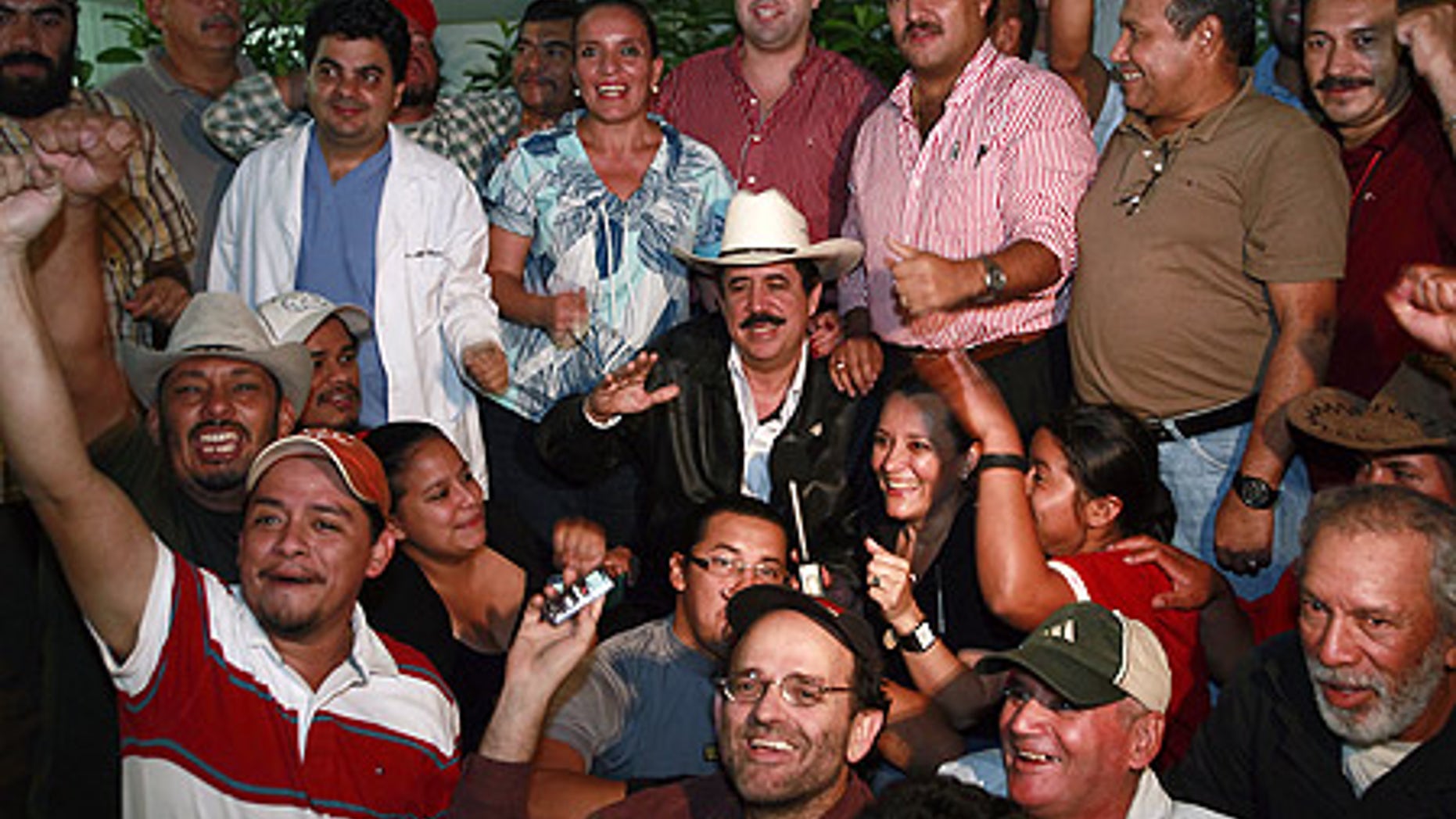 Oct. 30: Honduras' ousted President Manuel Zelaya surrounded by his supporters at the Brazilian embassy in Tegucigalpa.