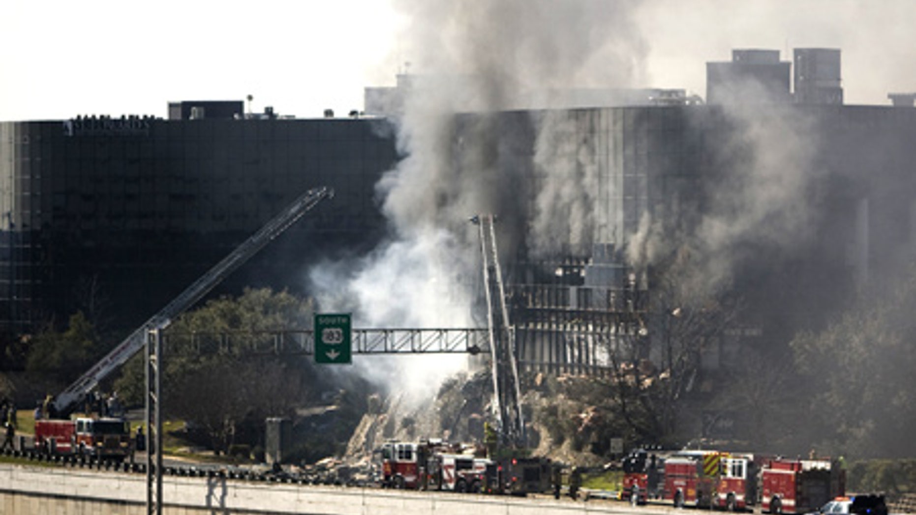 Feb. 18: Smoke billows from a 7 story building after a small plane crashed into it in Austin.