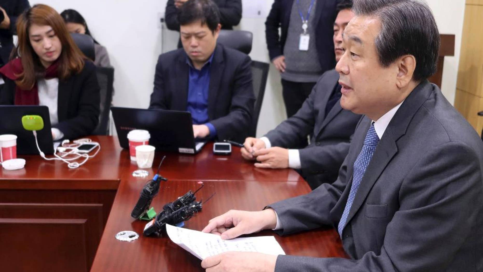 Kim Moo-sung, former chief of the ruling Saenuri Party, speaks during a press conference at the National Assembly in Seoul, South Korea, Tuesday, Dec. 13, 2016. The party is on verge of a split following President Park Geun-hye's parliamentary impeachment last week. (Lee Jung-hoon/Yonhap via AP)