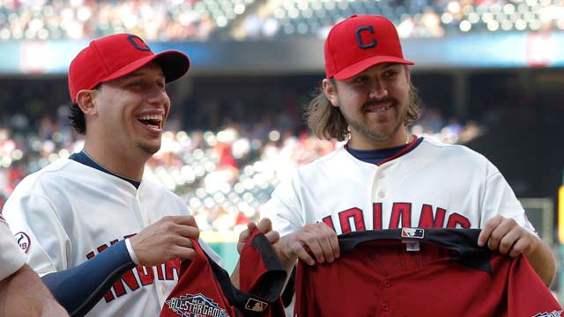 Cleveland Indians manager Manny Acta, shortstop Asdrubal Cabrera and relief pitcher Chris Perez at a presentation before their game against the Toronto Blue Jays in Cleveland on Saturday, July 9, 2011.