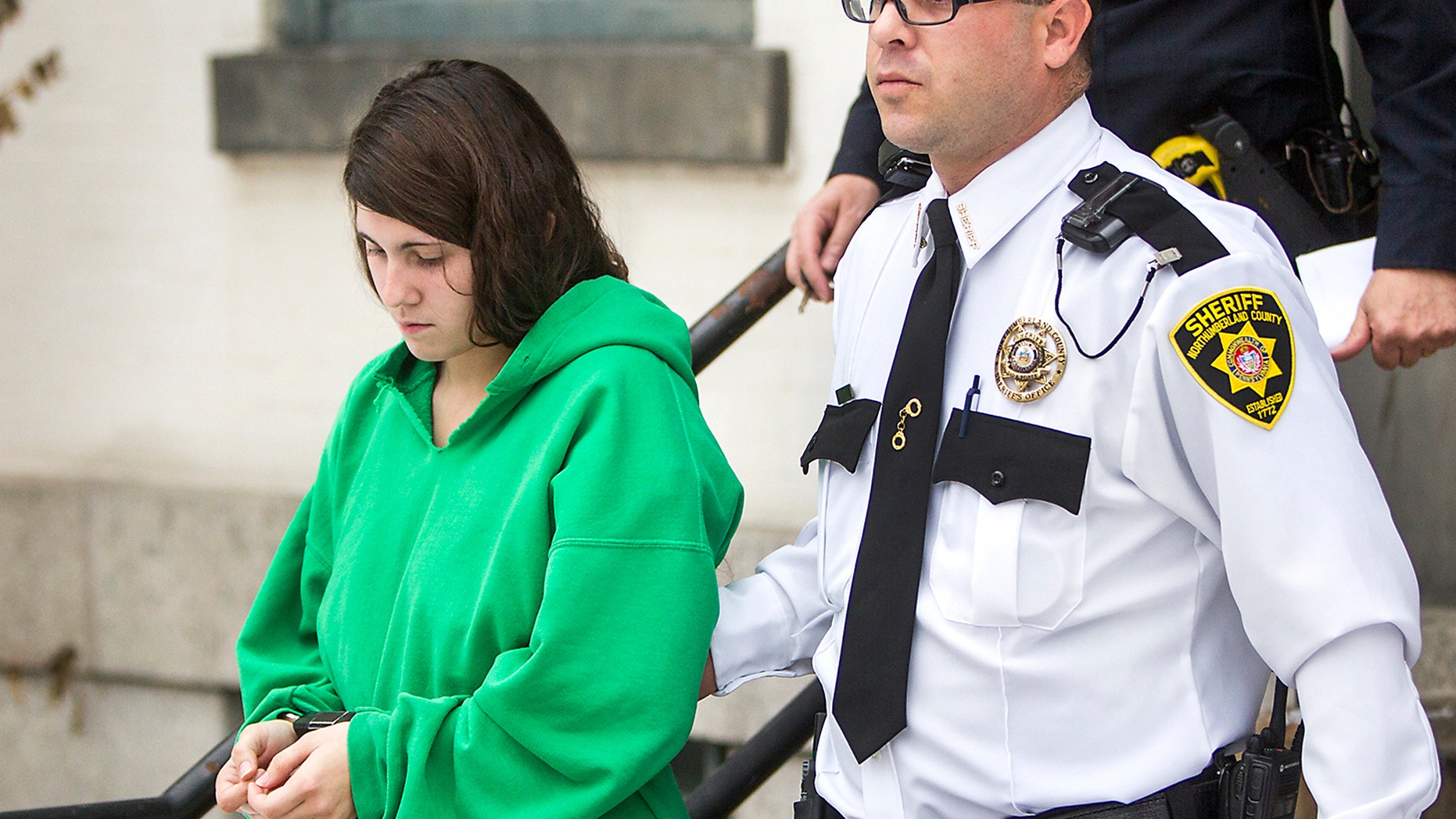 FILE - In this Dec. 20, 2013 file photo, Miranda Barbour is led out of the courthouse after her preliminary hearing in Sunbury, Pa. Police haven't substantiated Barbour's claims that she killed more than 20 people in four states before the killing she's now charged with committing with her newlywed husband, a prosecutor said Tuesday, Feb. 18, 2014. (AP Photo/PennLive.com, Christine Baker, File)