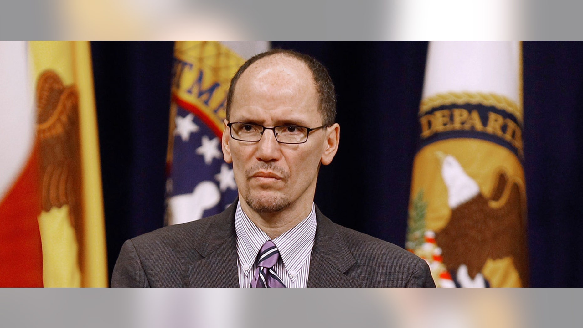 Assistant Attorney General for Civil Rights Thomas Perez listens to the Star Spangled Banner during the Dr. Martin Luther King, Jr. Commemorative Program at the Department of Justice January 11, 2011.