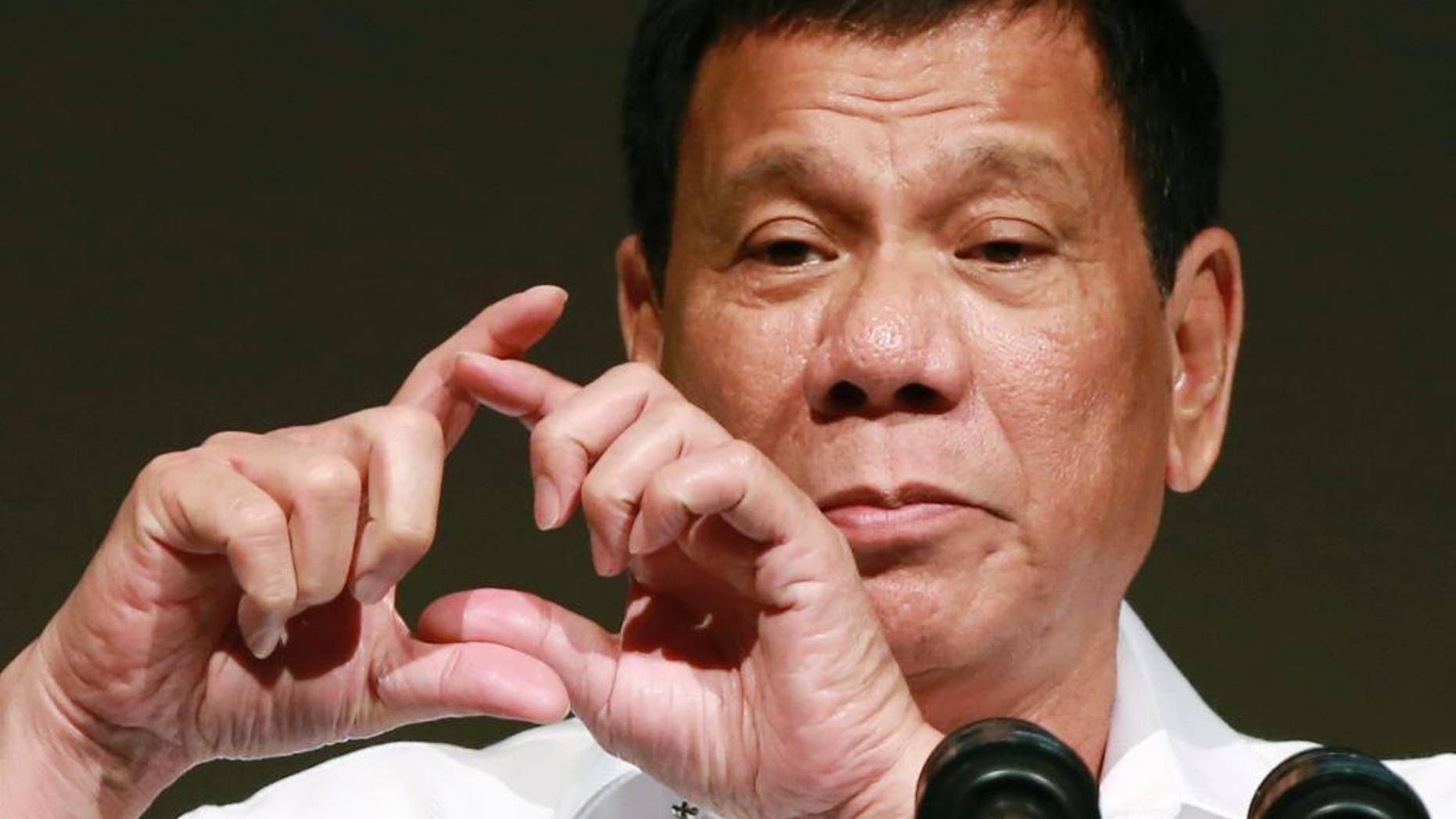 FILE - In this Oct. 26, 2016, file photo, Philippine President Rodrigo Duterte delivers a speech at the Philippine Economic Forum in Tokyo. Duterte telephoned U.S. President-elect Donald Trump late Friday, Dec. 2 and had a brief but "very engaging, animated conversation" in which both leaders invited each other to visit his country. In a video released by Duterte's close aide, Bong Go, the Philippine leader is seen smiling while talking to Trump late Friday and saying: "We will maintain ... and enhance the bilateral ties between our two countries." (AP Photo/Eugene Hoshiko, File)