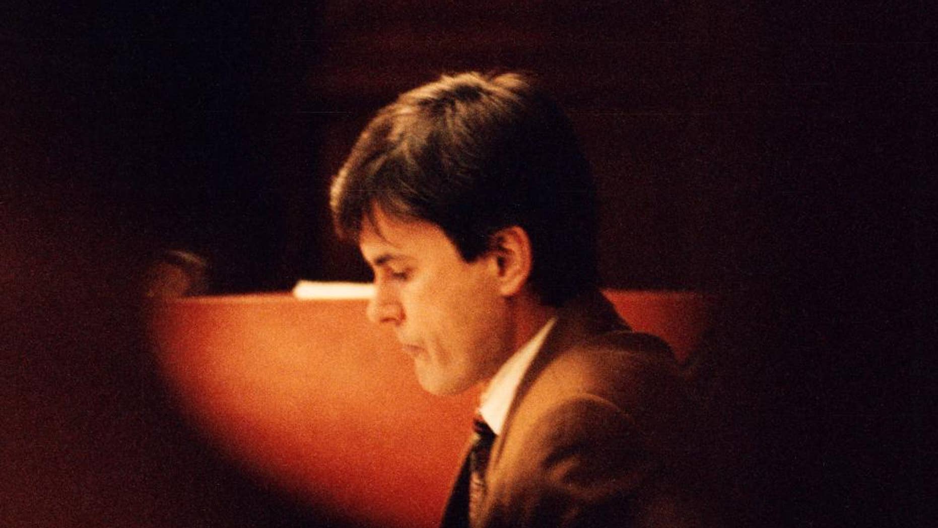 FILE - This is a Feb. 2, 1995 file photo of John Ausonius during a trial in the district court in Stockholm. Germany has asked Sweden to extradite John Ausonius one of its most notorious prisoners to stand trial in the murder of a Jewish woman in Frankfurt in 1992. Dubbed “Laserman” for the gunsight he used, Ausonius is serving a life sentence in Sweden for a series of shootings of immigrants in the 1990s. He was convicted of one murder and nine attempted murders. (Tobias Rostlund/TT, File Via AP)