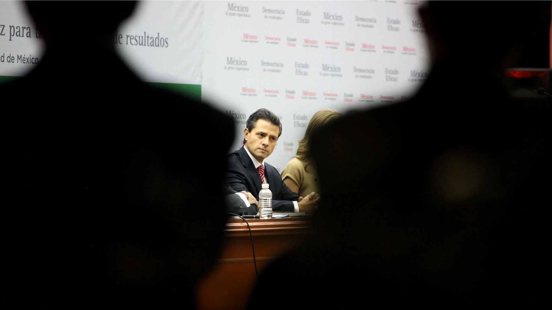 Enrique Pena Nieto, former governor of Mexico State and the leading presidential candidate for the Institutional Revolutionary Party, PRI, attends the presentation event of his book, "Mexico, la gran esperanza," or "Mexico, the great hope," in Mexico City, Wednesday Nov. 23, 2011. Pena Nieto, who has led in all the recent national polls, seeks to regain the presidency his party lost in 2000 after 71 years in power. The presidential elections will take place in July 2012. (AP Photo/Alexandre Meneghini)
