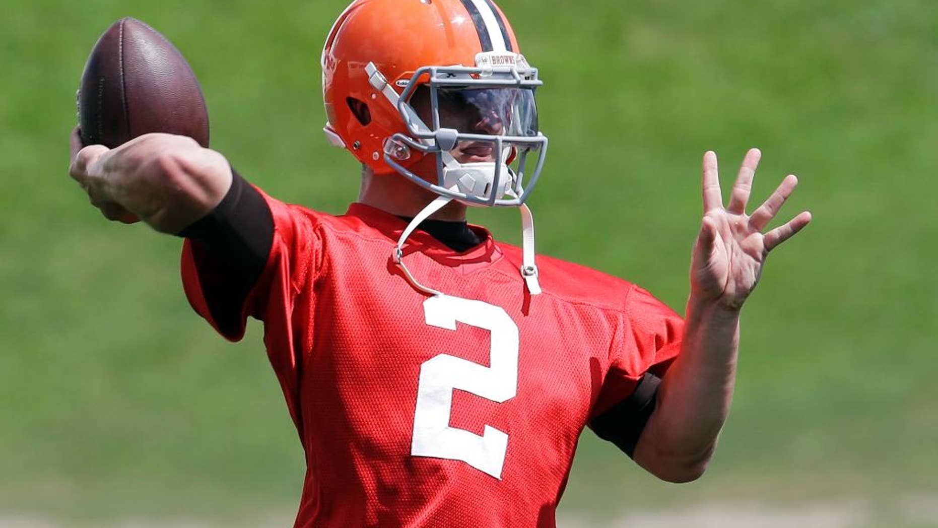 Cleveland Browns quarterback Johnny Manziel passes during practice at the NFL football team's facility in Berea, Ohio Wednesday, Sept. 3, 2014. Manziel begins the 2014 season on the bench behind starter Brian Hoyer. (AP Photo/Mark Duncan)