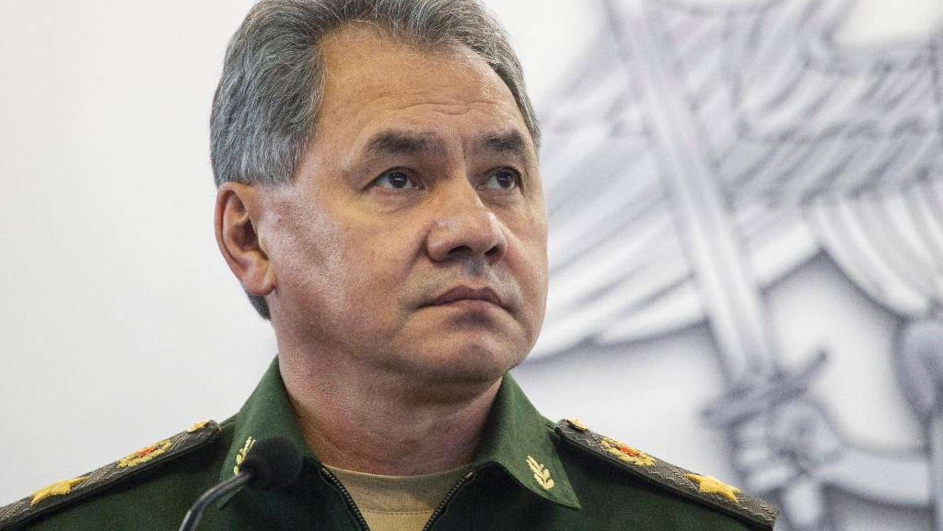 FILE In this file photo taken on Monday, Oct. 5, 2015, Russian Defence Minister Sergei Shoigu attends an opening ceremony during an Innovation exhibition of the Russian Defense Ministry in Kubinka outside Moscow, Russia. Shoigu said Friday, March 25, 2016 that NATO's moves to build up its military forces near Russia's borders has caused Moscow's concern and required a response. (AP Photo/Pavel Golovkin, File)