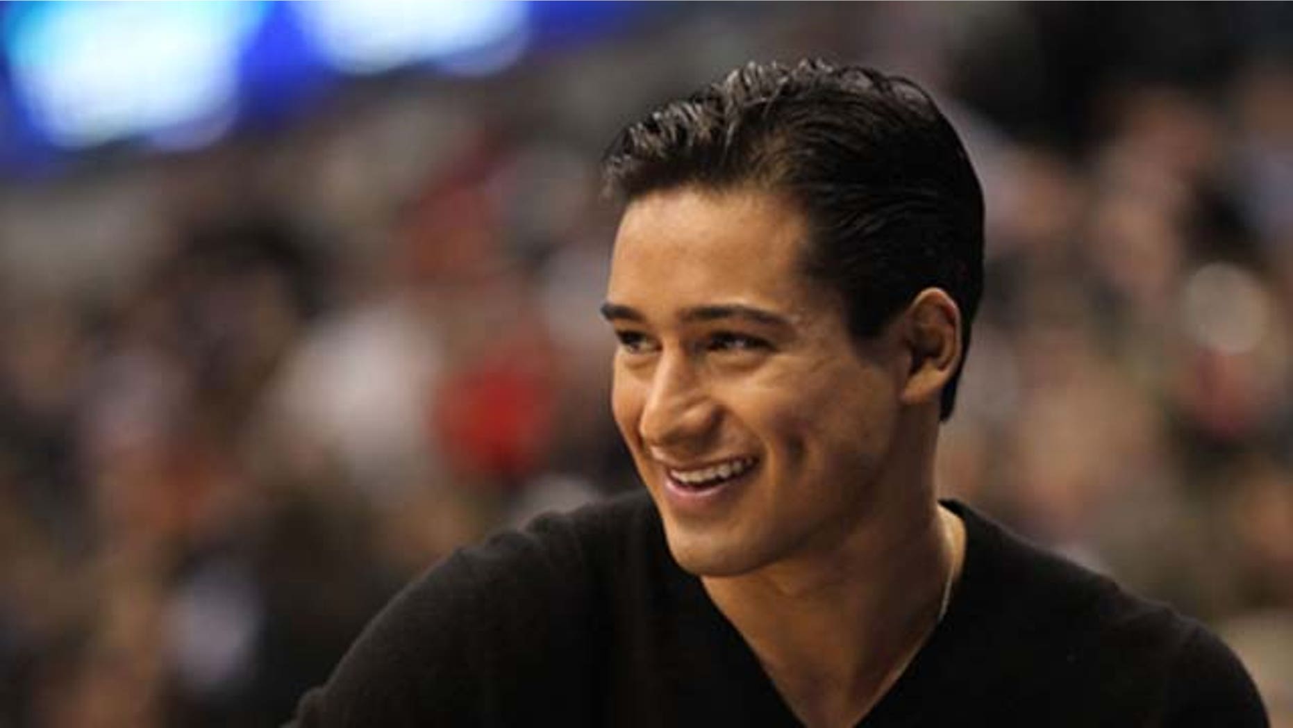 Feb.13, 2010: Actor Mario Lopez looks on during the Haier Shooting Stars Competition on All-Star Saturday Night, part of 2010 NBA All-Star Weekend at American Airlines Center in Dallas, Texas.