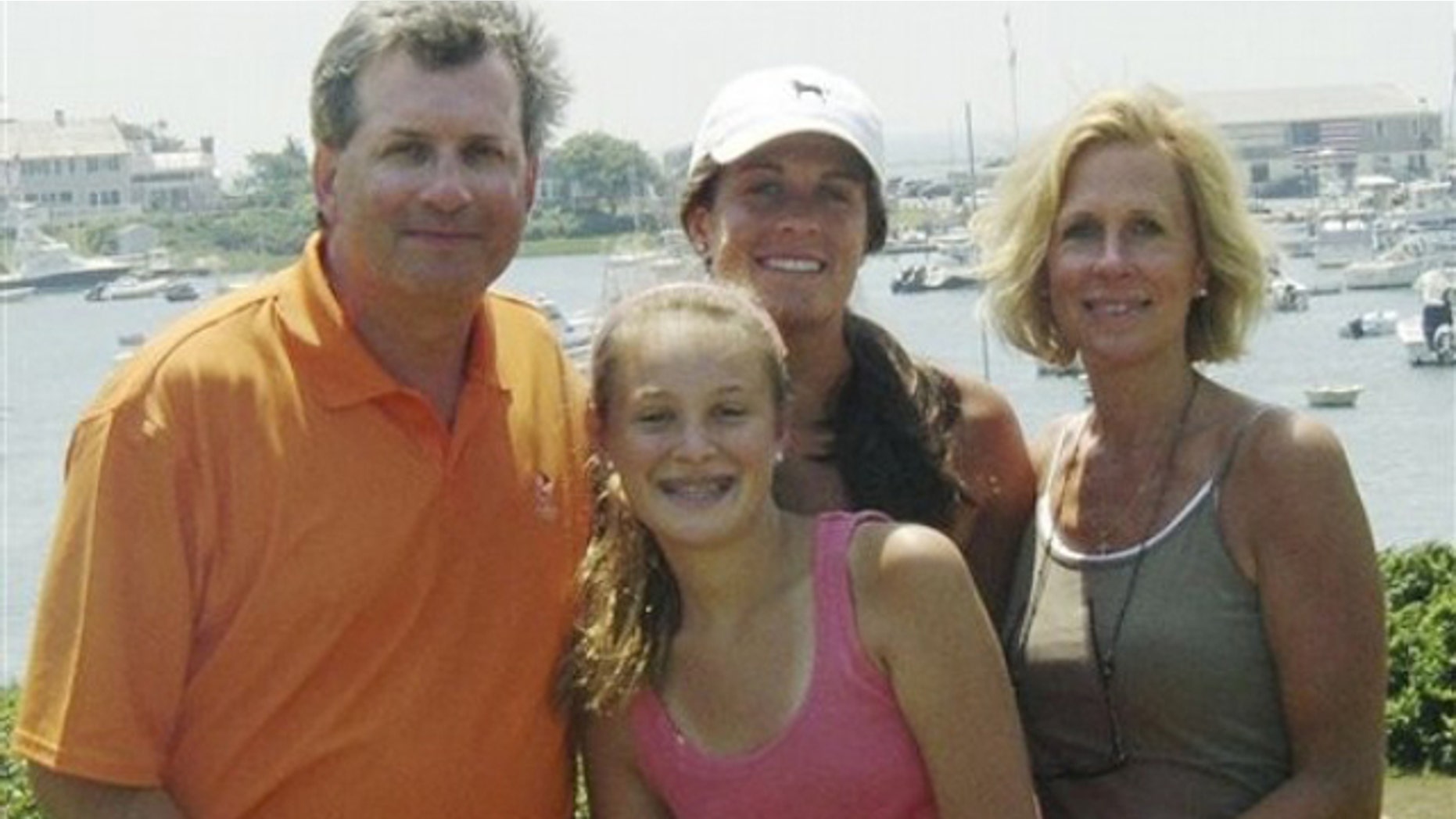 This June 2007 photo provided by Dr. William Petit Jr. , shows Dr. Petit, left, with his daughters Michaela, front, Hayley, center rear, and his wife, Jennifer Hawke-Petit, on Cape Cod, Mass. (AP)