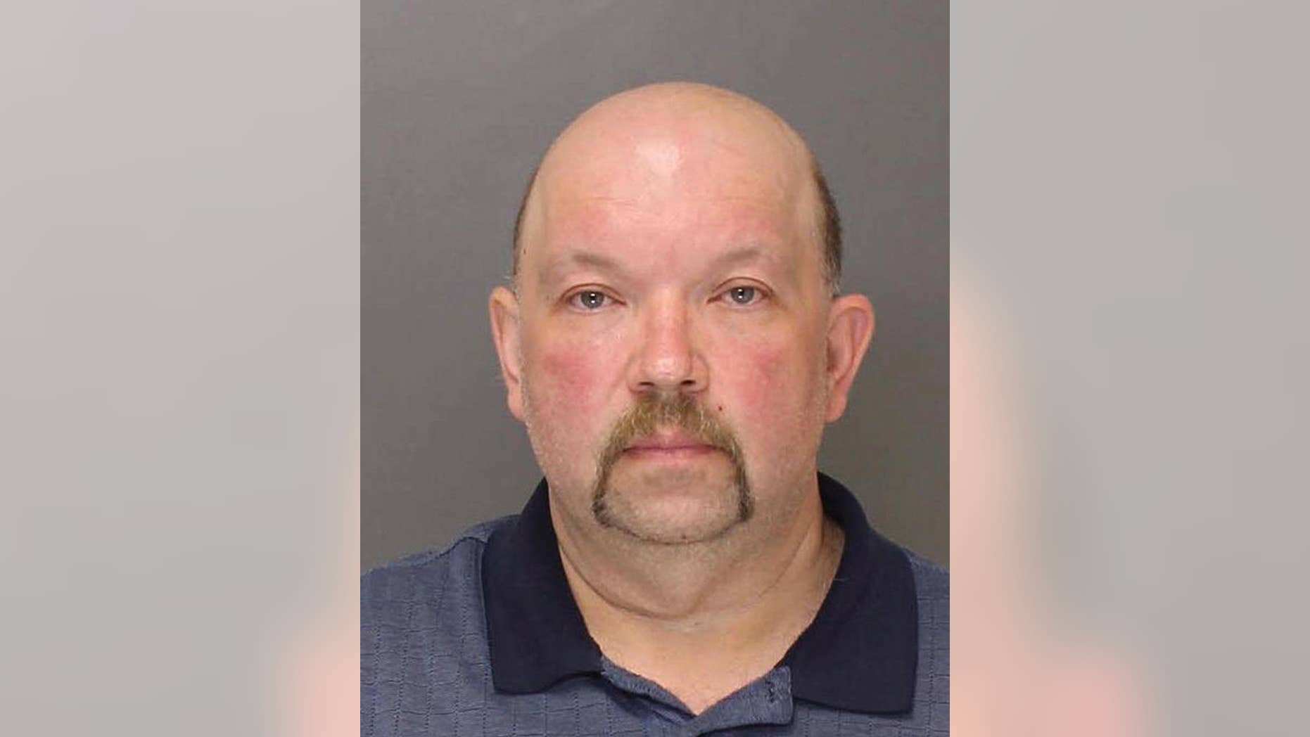 This May 2016 booking photo provided by the Lehigh County DUI Processing Center shows Michael Horvath of Saylorsburg, Pa. Horvath was arrested Thursday, Oct. 13, 2016, after investigators say they found a bone on his property matching the DNA of Holly Grim, a woman last seen in November 2013 who was a co-worker of Horvath at a church organ manufacturer. (Lehigh County DUI Processing Center via AP)