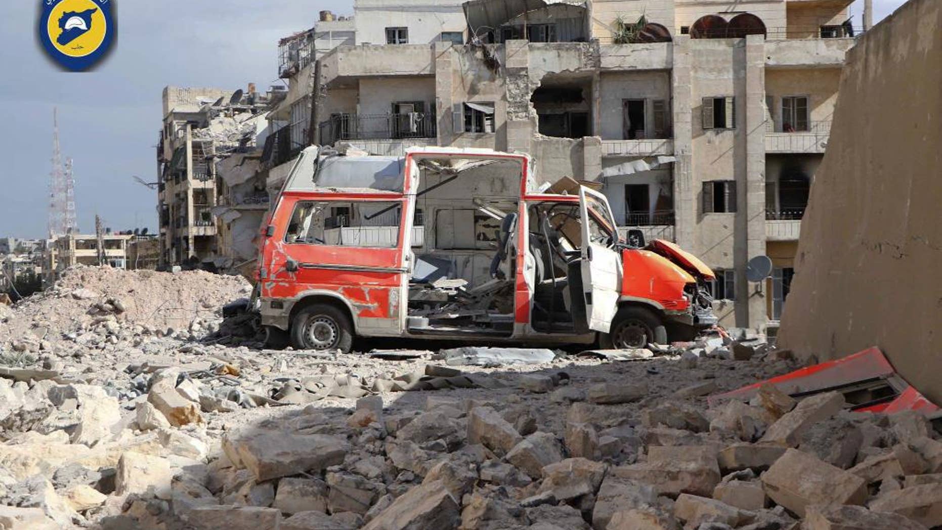 Sept. 23, 2016: In this photo provided by the Syrian Civil Defense group known as the White Helmets, a destroyed ambulance is seen outside the Syrian Civil Defense main center after airstrikes in Ansari neighborhood in the rebel-held part of eastern Aleppo, Syria.