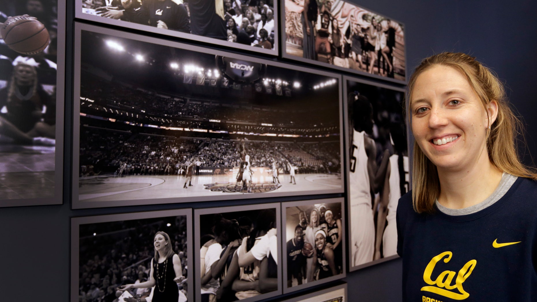 ADVANCE FOR WEEKEND EDITIONS, NOV. 2-3 - University of California women's basketball coach Lindsay Gottlieb stands next to photos in her office on Wednesday, Oct. 30, 2013, in Berkeley, Calif. The Golden Bears are determined for another important adventure this season: Returning to the Final Four after making history with the program's first appearance last season. (AP Photo/Ben Margot)
