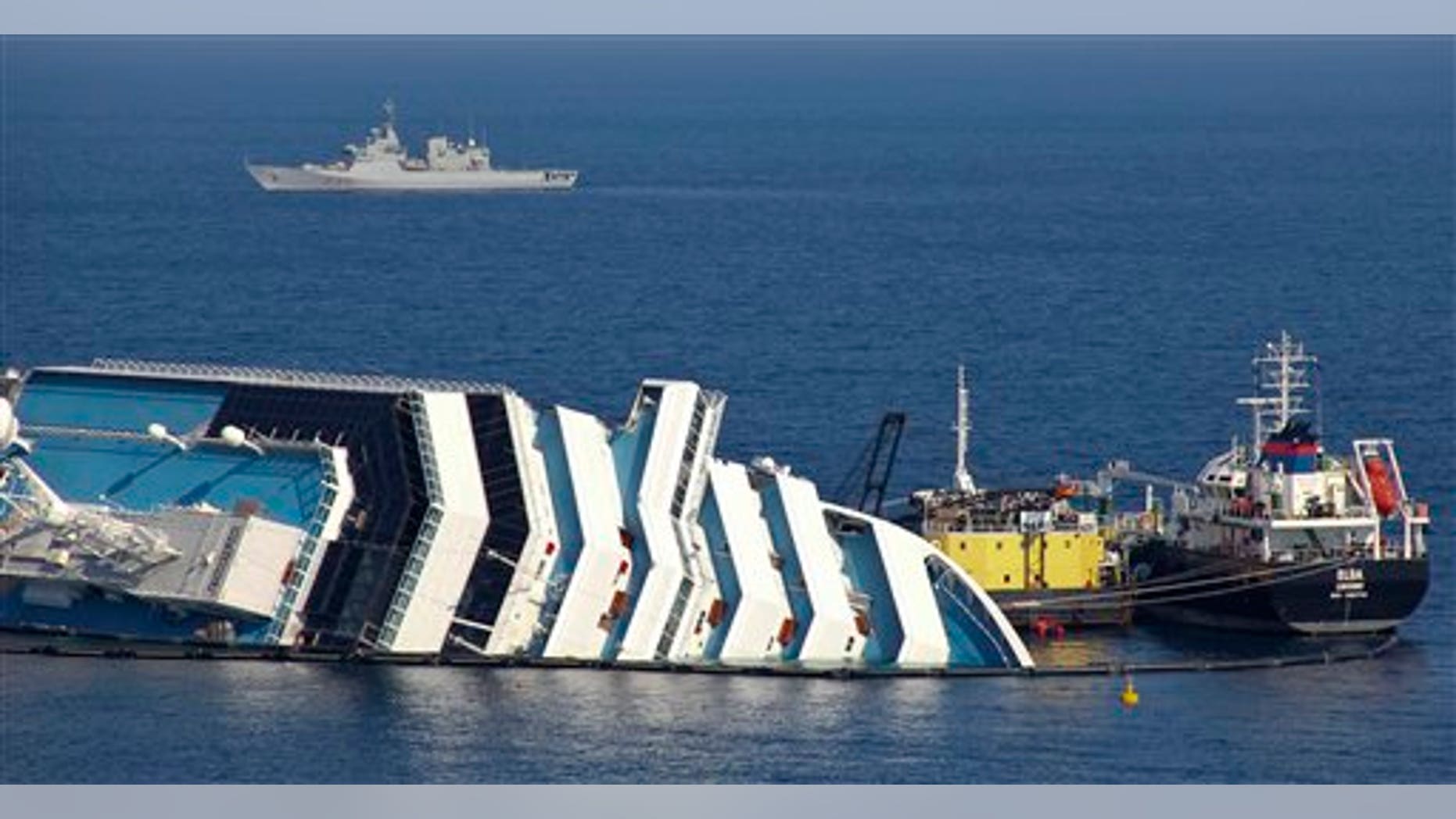 Feb. 13: Ongoing operations to remove fuel from the half sunken hulk of the luxury ship Costa Concordia a month after it ran aground are seen outside the port of Isola del Giglio island in Tuscany, Italy.