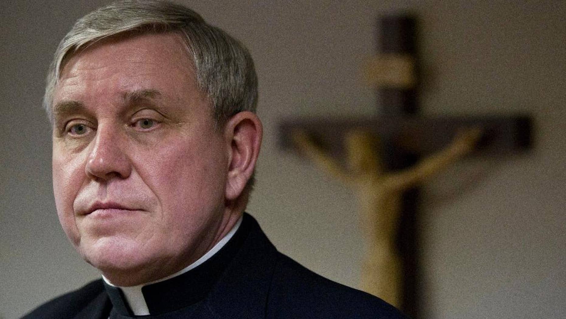 FILE - This Jan. 4, 2011 file photo shows Milwaukee Archbishop Jerome Listecki at a news conference in St. Francis, Wis. Listecki said Tuesday, Aug. 4, 2015 the Milwaukee archdiocese has agreed to a $21 million settlement with victims of clergy abuse. The proposed settlement sets the stage for the archdiocese to close a bankruptcy proceeding that was filed in January 2011. (AP Photo/Morry Gash, File)