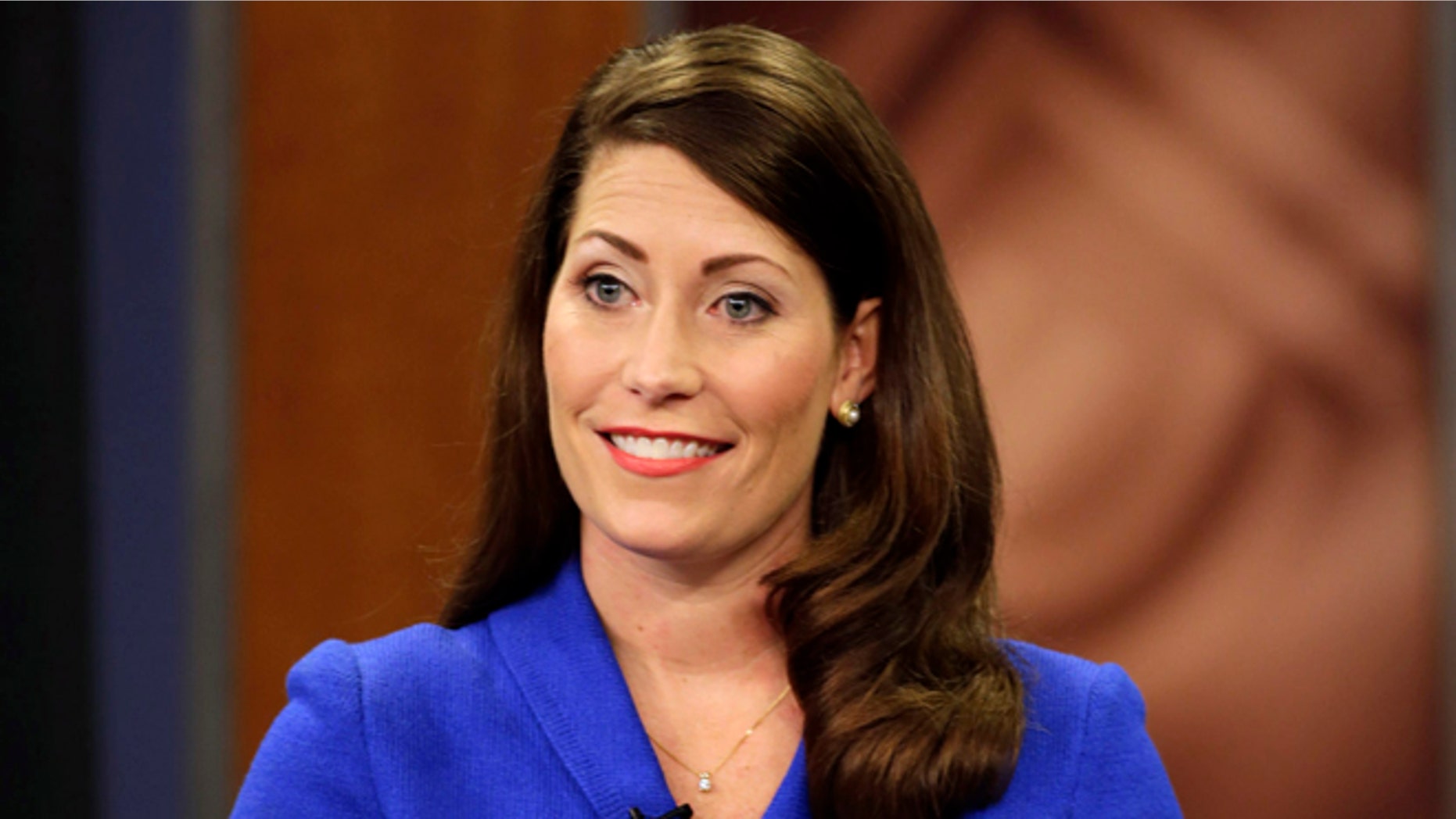 In this Monday, Oct. 13, 2014 photo, Kentucky Secretary of State Alison Lundergan Grimes appears on "Kentucky Tonight" television broadcast live from KET studios in Lexington, Ky.