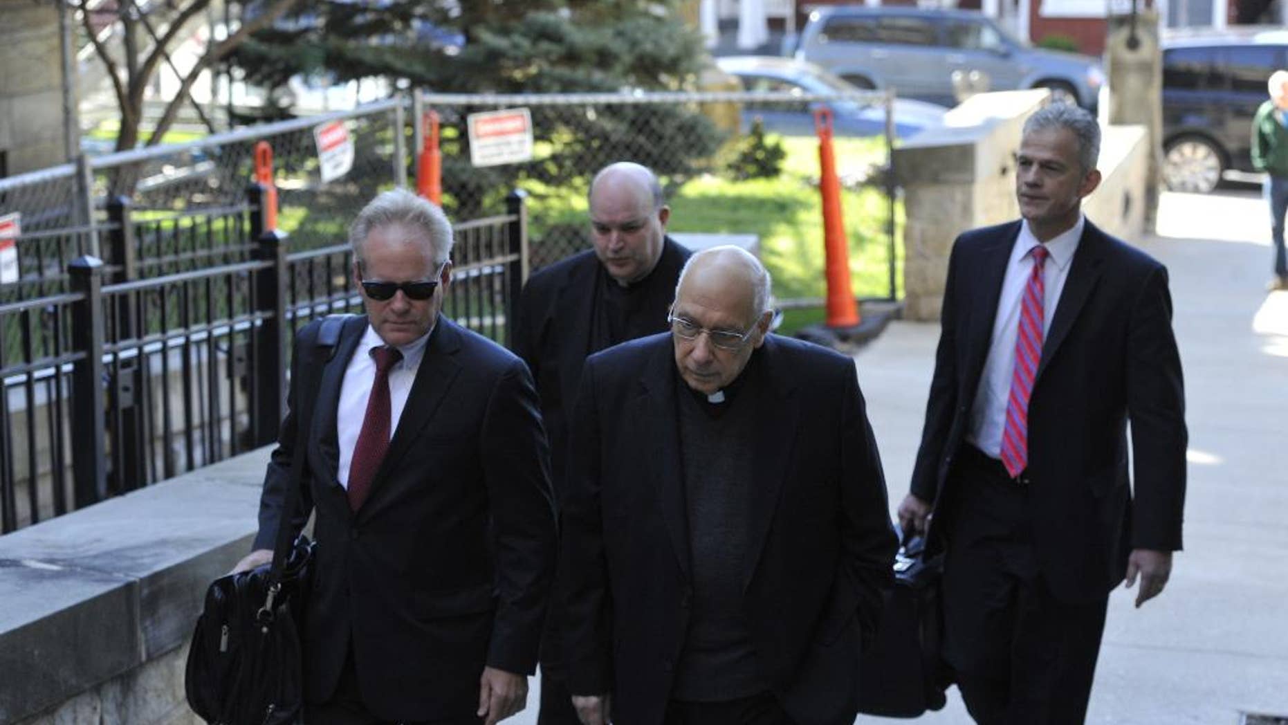 FILE - In this Thursday, April 14, 2016 file photo, attorneys lead Franciscans Giles Schinelli, front, and Anthony Criscitelli to their hearing at the Blair County courthouse in Hollidaysburg, Pa. Testimony is set to resume in the case of three Franciscan friars charged with allowing a suspected sexual predator to teach at a Pennsylvania high school and hold other jobs where he molested more than 100 children. A preliminary hearing on Wednesday, April 27, 2016, will determine whether Schinelli, Robert D'Aversa and Criscitelli will stand trial on child endangerment and conspiracy charges. (Todd Berkey/The Tribune-Democrat via AP, File) MANDATORY CREDIT