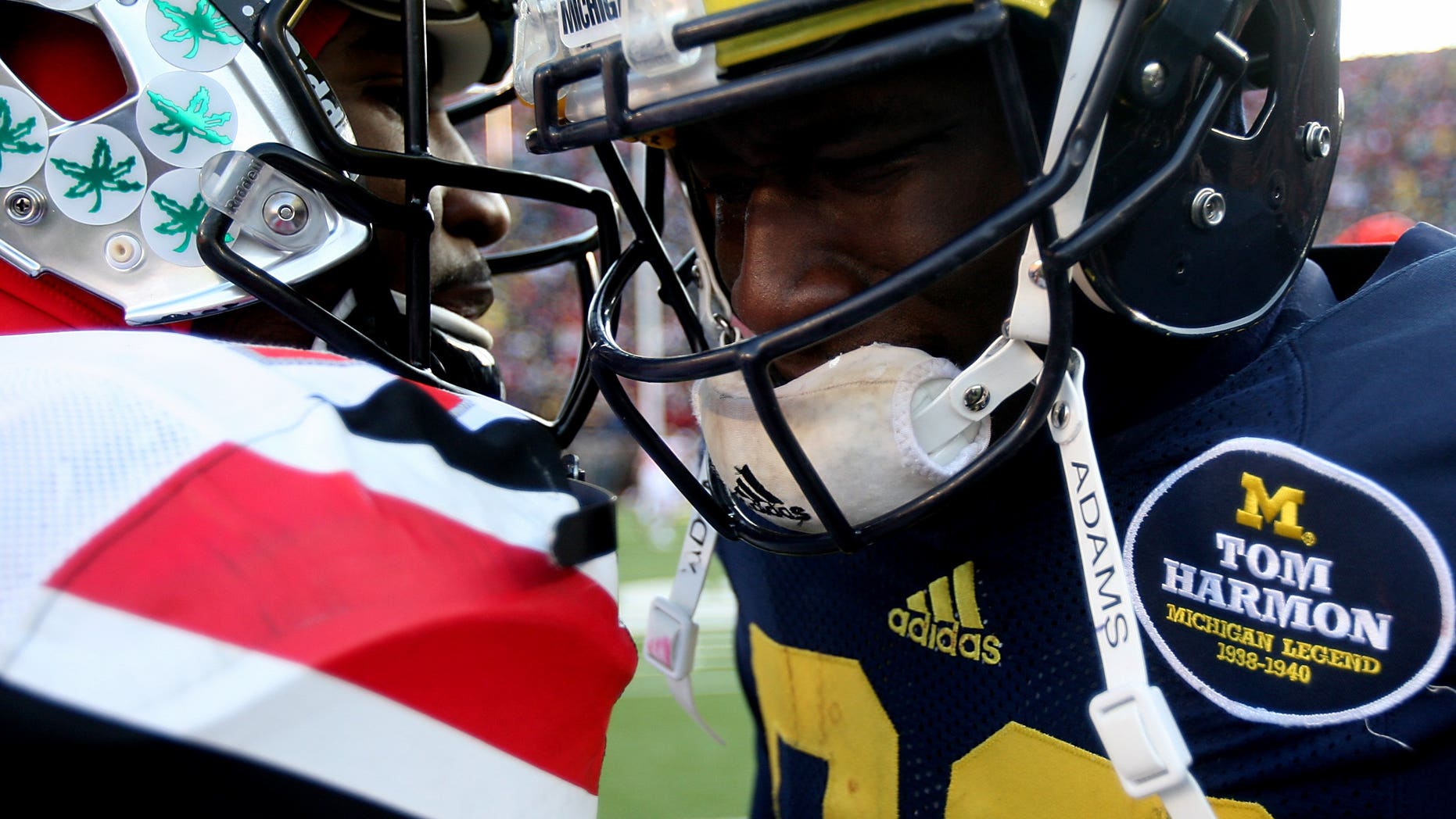 Michigans' Devin Gardner is comforted by Ohio States' Braxton Miller after Michigan's 42-41 loss in an NCAA college football game Saturday, Nov. 30, 2013 at Michigan Stadium in Ann Arbor, Mich. (AP Photo/Detroit Free Press, Kirthmon F. Dozier) DETROIT NEWS OUT; NO SALES, MANDATORY CREDIT