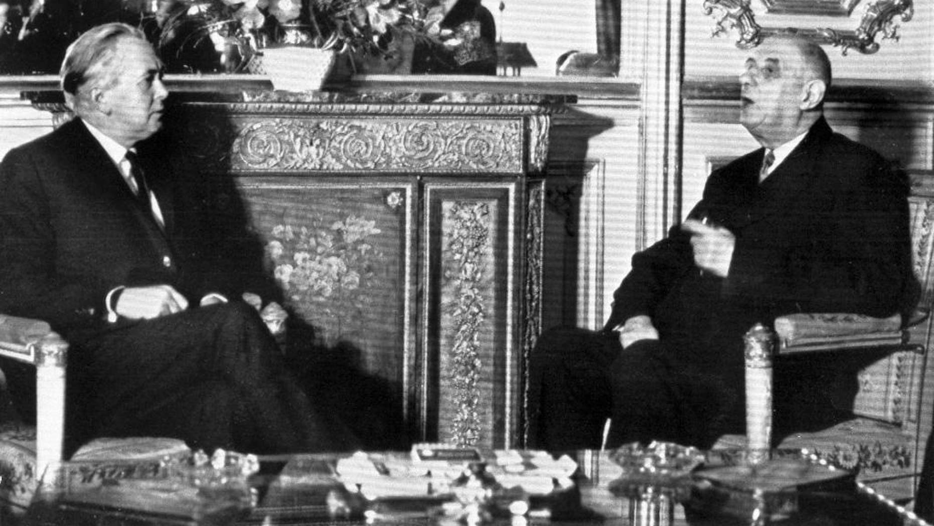 FILE - In this Jan. 24, 1967 file photo, British Prime Minister Harold Wison, left, sits in a room of the the Elysee Palace in Paris, France with French President Charles de Gaulle. Later that year, de Gaulle would veto Britain's efforts to join the-then European Economic Community. It was only after de Gaulle's death that Britain eventually joined the EEC in 1973. Britain holds a vote on June 23, 2016 to decide whether to stay in the European Union. (AP Photo, File)