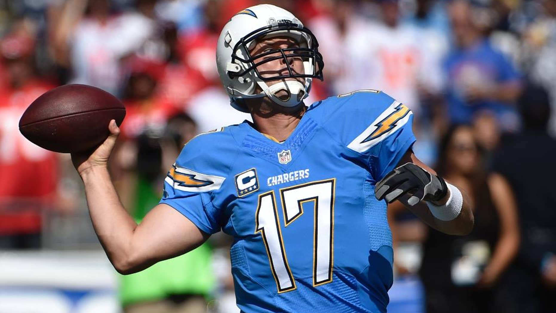 San Diego Chargers quarterback Philip Rivers throws a pass against the Kansas City Chiefs during the first half of an NFL football game, Sunday, Oct. 19, 2014, in San Diego. (AP Photo/Denis Poroy)