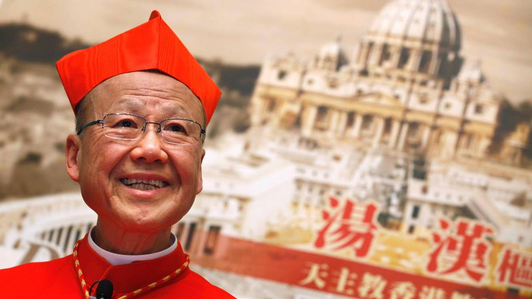 FILE - In this March 2, 2012 file photo, newly-selected Cardinal John Tong speaks to the media in Hong Kong. The head of the Catholic church in Hong Kong has expressed optimism that the Vatican and Beijing can overcome the controversial issue of bishop appointments lying at the core of a decades-long dispute. Tong said in a lengthy essay published by the Hong Kong diocese that a "preliminary consensus has reportedly been reached" on the matter, and suggested that the pope could retain veto power over the ordination of mainland bishops under the new arrangement.(AP Photo/Kin Cheung, File)