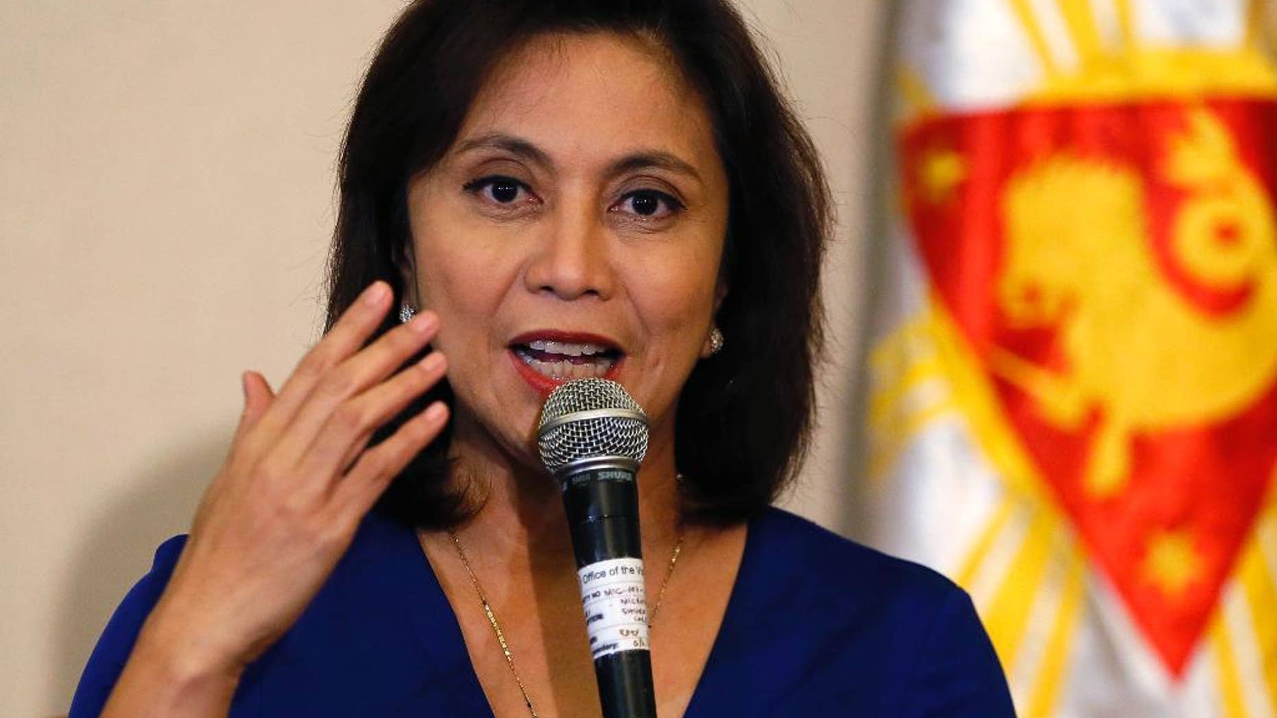 FILE - In this Dec. 5, 2016 file photo, Philippine Vice President Leni Robredo answers questions from the media during a news conference following her resignation from her cabinet post under President Rodrigo Duterte in suburban Quezon city, south of Manila, Philippines. The Philippine vice president has raised alarms over the president's bloody crackdown against illegal drugs, which she says can't be solved "with bullets alone," and she also asked Filipinos to "defy brazen incursions on their rights." The comments are one of Robredo's sharpest critiques so far of President Rodrigo Duterte's campaign and are likely to antagonize him because they are intended for an international forum of human rights advocates, whom he has often lambasted. (AP Photo/Bullit Marquez, File)