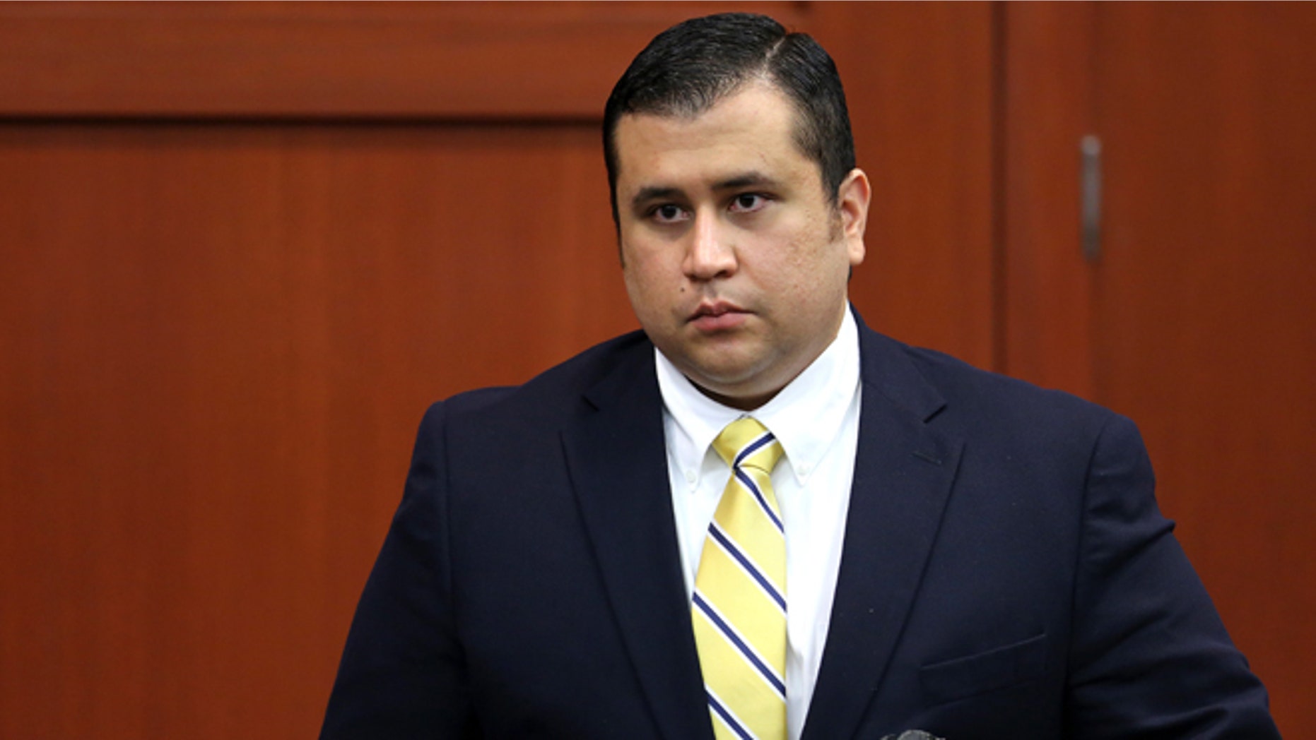 George Zimmerman leaves the courtroom on recess during the 15th day of his murder trial in Seminole circuit court June 28, 2013 in Sanford, Florida. (Photo by Joe Burbank-Pool/Getty Images)