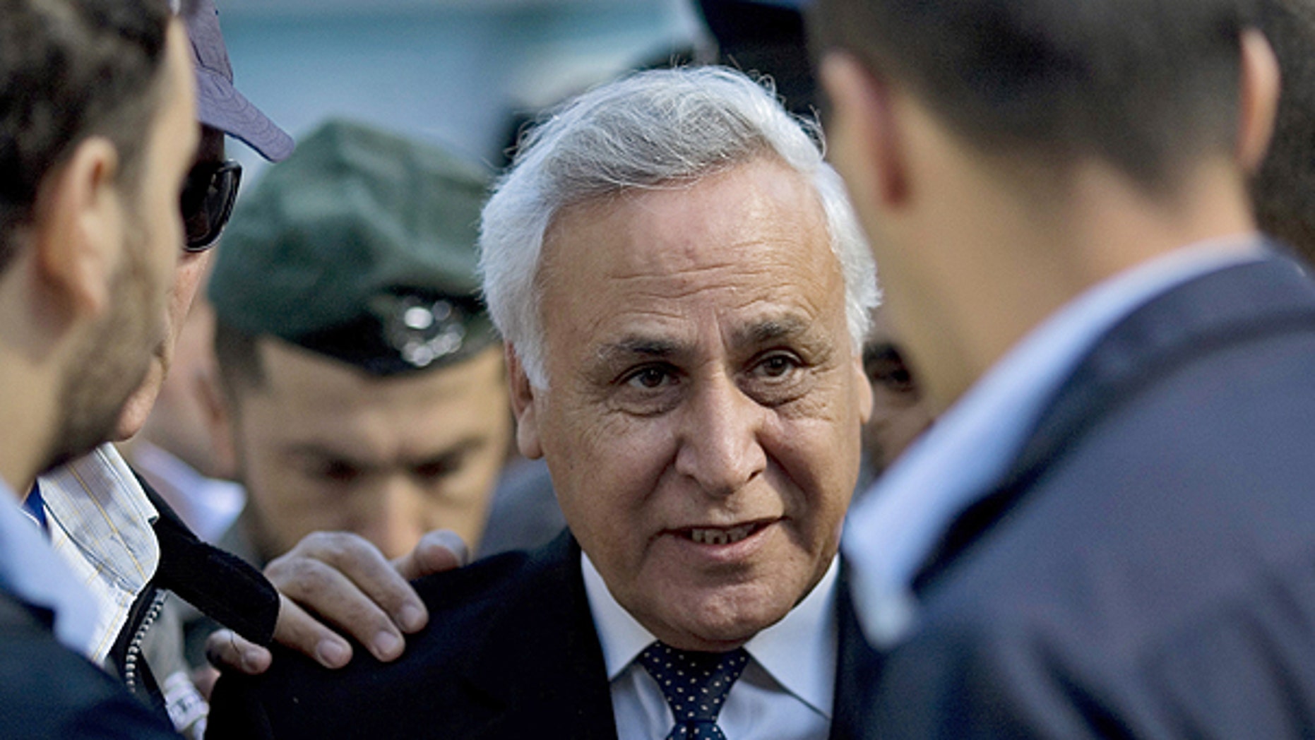 March 22: Former Israeli President Moshe Katsav, center, arrives at a court in Tel Aviv.