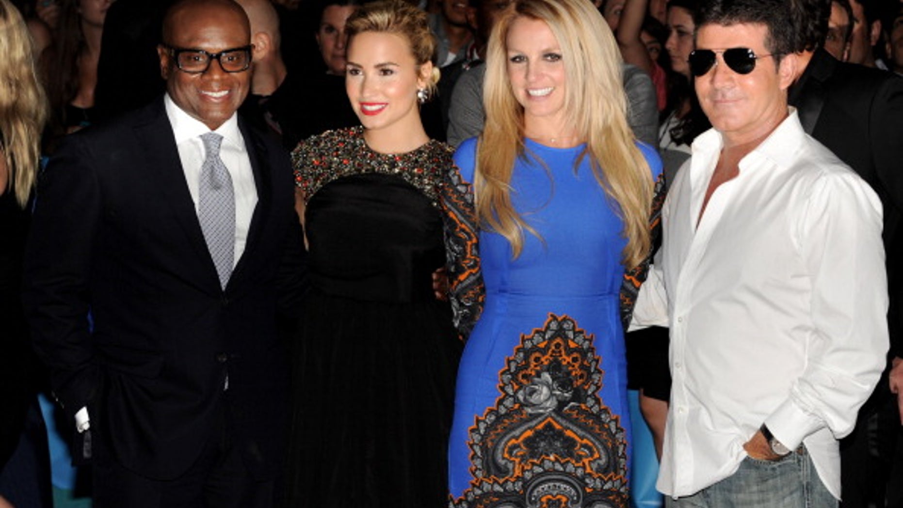 The X Factor judges (L-R) L.A. Reid, Demi Lovato, Britney Spears and Simon Cowell pose in Los Angeles, California.