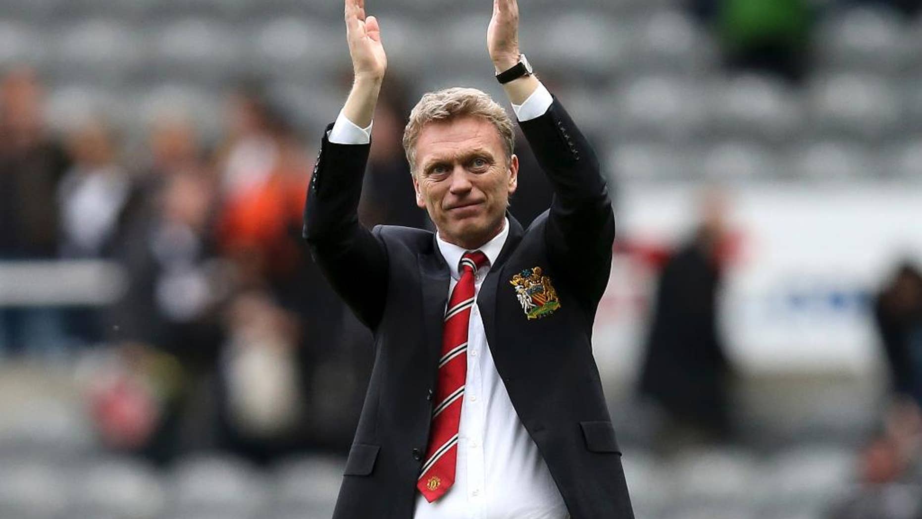 FILE - In this April 5, 2014 file photo, Manchester United manager David Moyes celebrates the team's victory over Newcastle United at the end of their English Premier League soccer match at St James' Park, Newcastle, England. Spanish club Real Sociedad hired Moyes on Monday, Nov. 10, giving the Scotsman a chance to revive his career after his failed stint at Old Trafford. It is Moyes' first coaching assignment since being fired last season after less than a year in charge at United, where he took the top job after Alex Ferguson retired. (AP Photo/Scott Heppell, File)