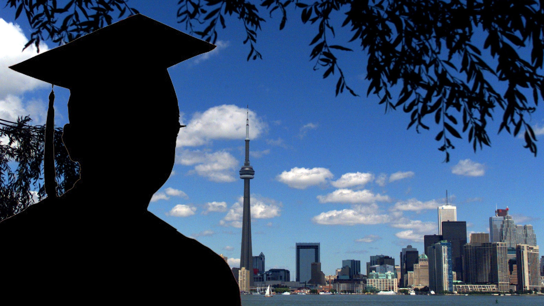 391776 02: (FILE PHOTO) The CN Tower and the Skydome highlight the Toronto skyline in his undated file photo. The International Olympic Committee (IOC) meets in Moscow July 13, 2001 to decide between front runners Beijing, Paris and Toronto for the site of the 2008 summer Olympics. (Photo by Carlo Allegri/Getty Images)