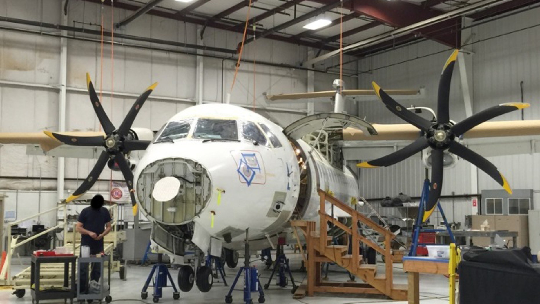 This photo provided by the Justice Department, taken in April 2015, shows a Drug Enforcement Agency (DEA) ATR 42-500 at the Defense Department's subcontractor's facility. A specialized plane at the DEA to fly missions in Afghanistan that has cost taxpayers $86 million has remained grounded for seven years. The Justice Department inspector general issued a scathing audit Wednesday, March 30, 2016, spurred by a July 2014 whistleblower’s report. (Justice Department via AP)