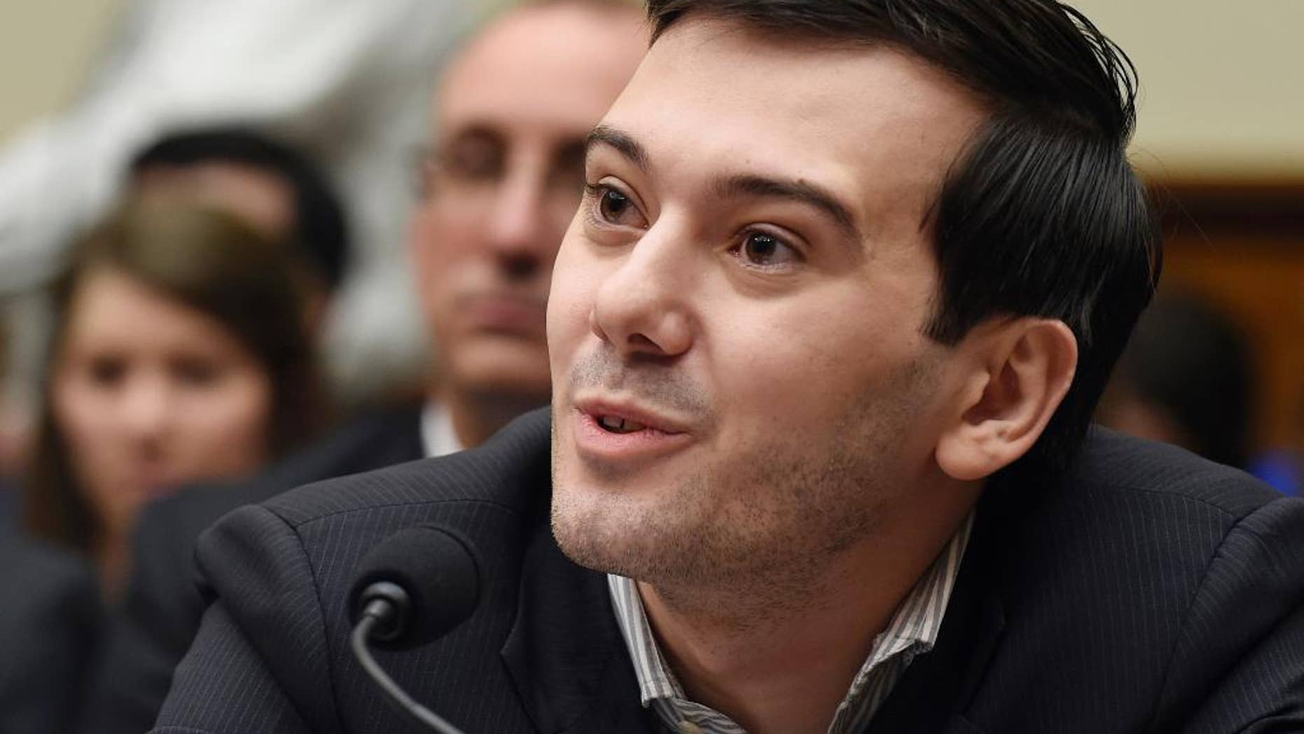 FILE - In this Feb. 4, 2016 file photo, pharmaceutical chief Martin Shkreli speaks on Capitol Hill in Washington during the House Committee on Oversight and Reform Committee hearing on a decision by his former company, Turing Pharmaceuticals, to significantly raise the price of the anti-parasitic medication Daraprim. Heated protests at the University of California, Davis brought the cancellation of planned speeches by far-right commentator Milo Yiannopoulos and former pharmaceutical executive Shkreli shortly before the event was to begin. University police put up barricades as protesters shouting "shut it down" grew increasingly rowdy in the hours leading up to the talks on Friday night, Jan. 13, 2017. (AP Photo/Susan Walsh, File)
