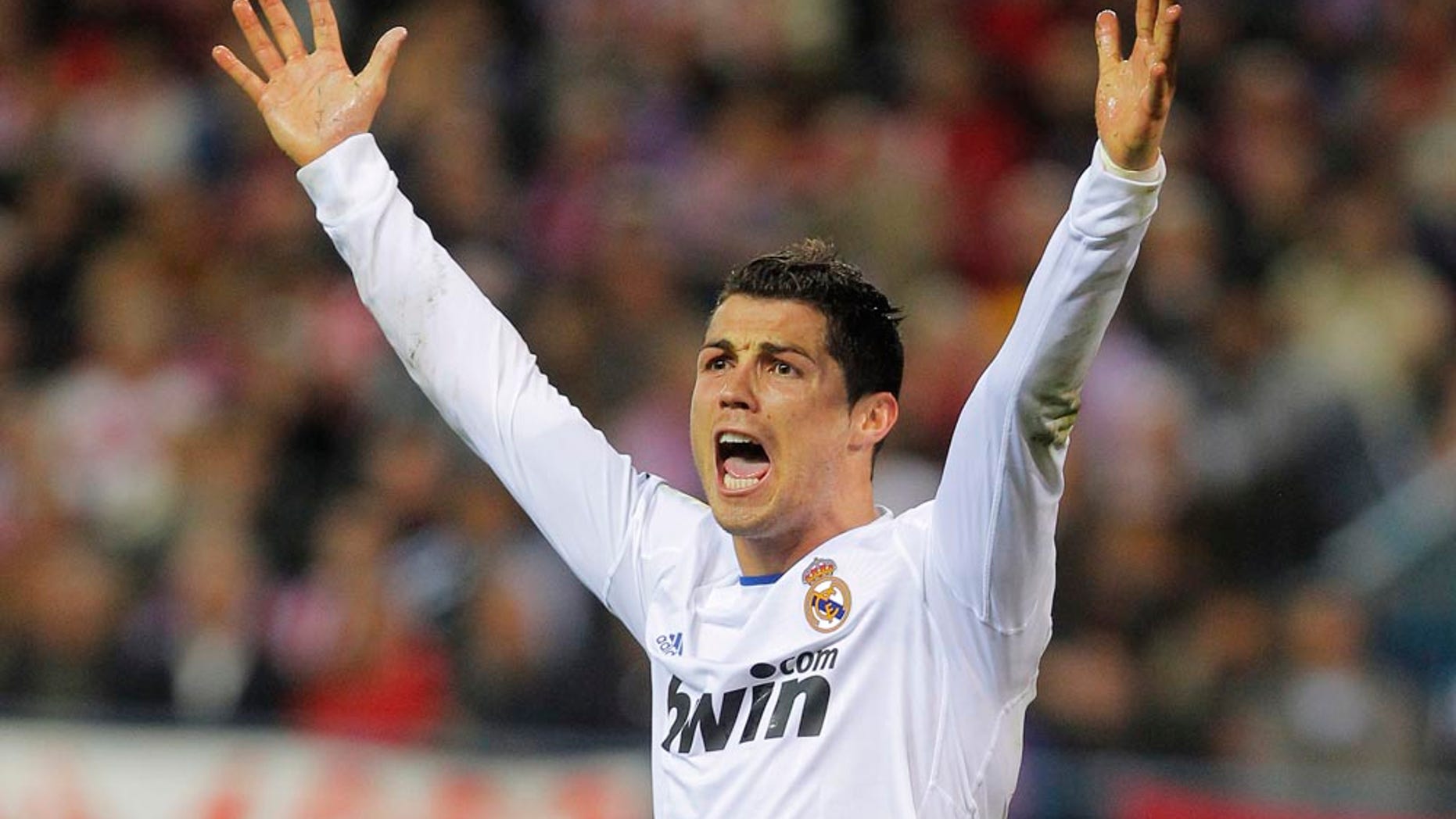 Real Madrid's Cristiano Ronaldo from Portugal reacts during a Spanish La Liga soccer match against Atletico Madrid at the Vicente Calderon stadium in Madrid, Saturday, March 19, 2011. (AP Photo/Andres Kudacki)