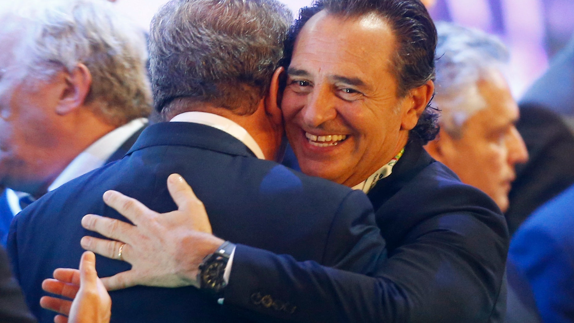 England manager Roy Hodgson hugs Italy head coach Cesare Prandelli, right, after the draw ceremony for the 2014 soccer World Cup in Costa do Sauipe near Salvador, Brazil, Friday, Dec. 6, 2013. (AP Photo/Victor R. Caivano)