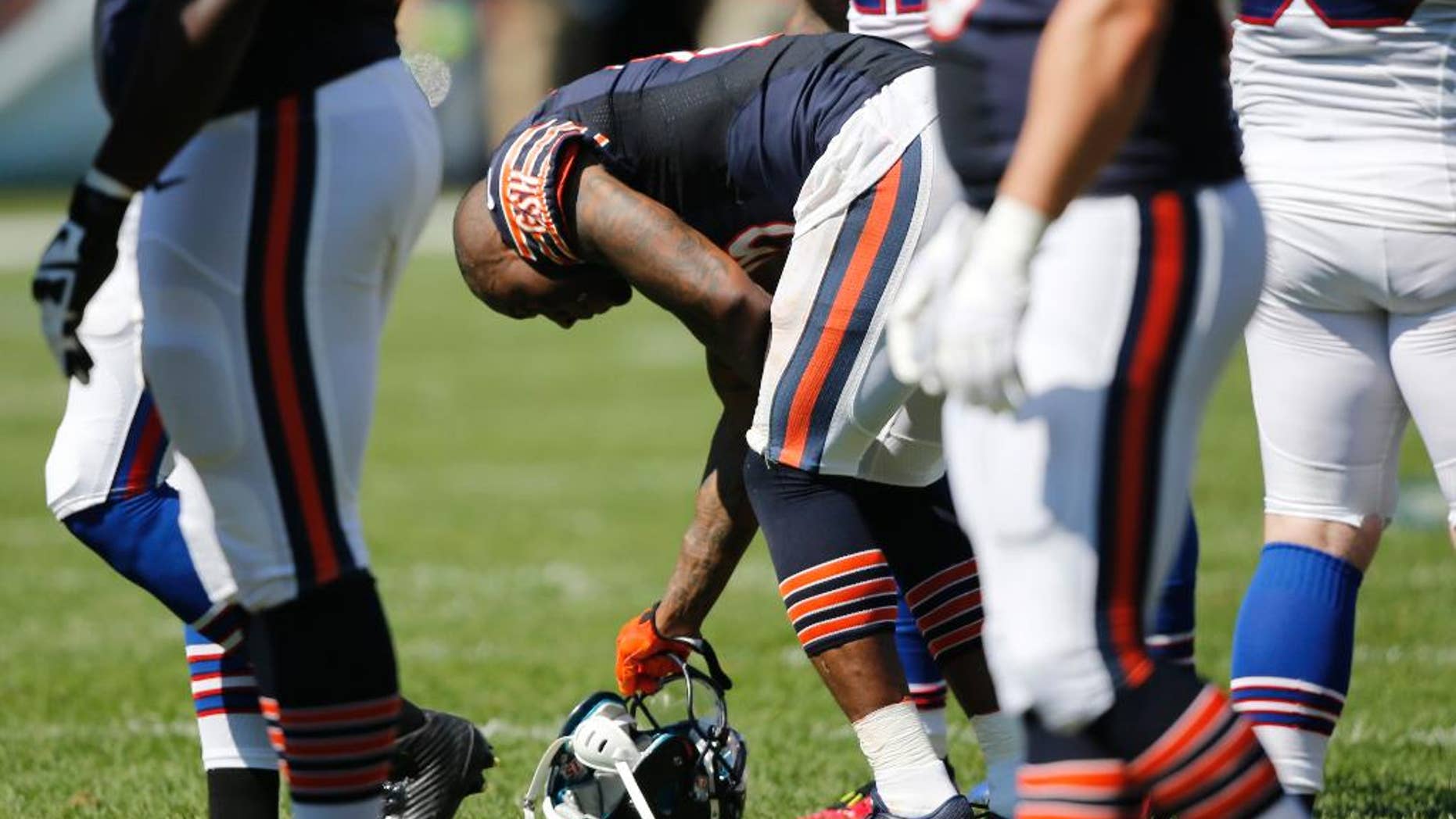 Chicago Bears wide receiver Brandon Marshall (15) pauses after a play during the second half of an NFL football game against the Buffalo Bills Sunday, Sept. 7, 2014, in Chicago. (AP Photo/Charles Rex Arbogast)